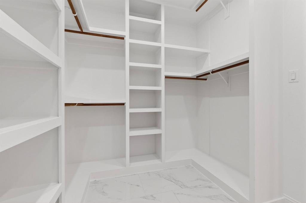 404 Luzon Street Tool, TX 75143 - Photo 23 of 40 a view of an empty walk in closet