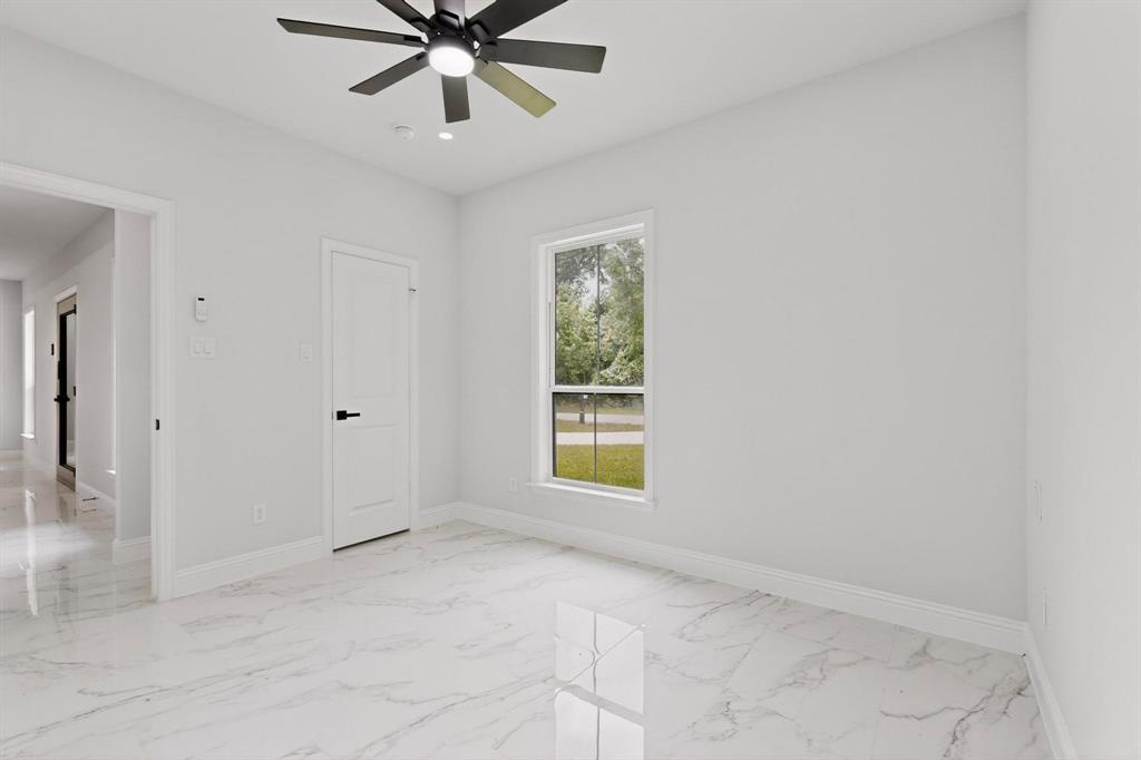 404 Luzon Street Tool, TX 75143 - Photo 24 of 40 a view of an empty room with a window