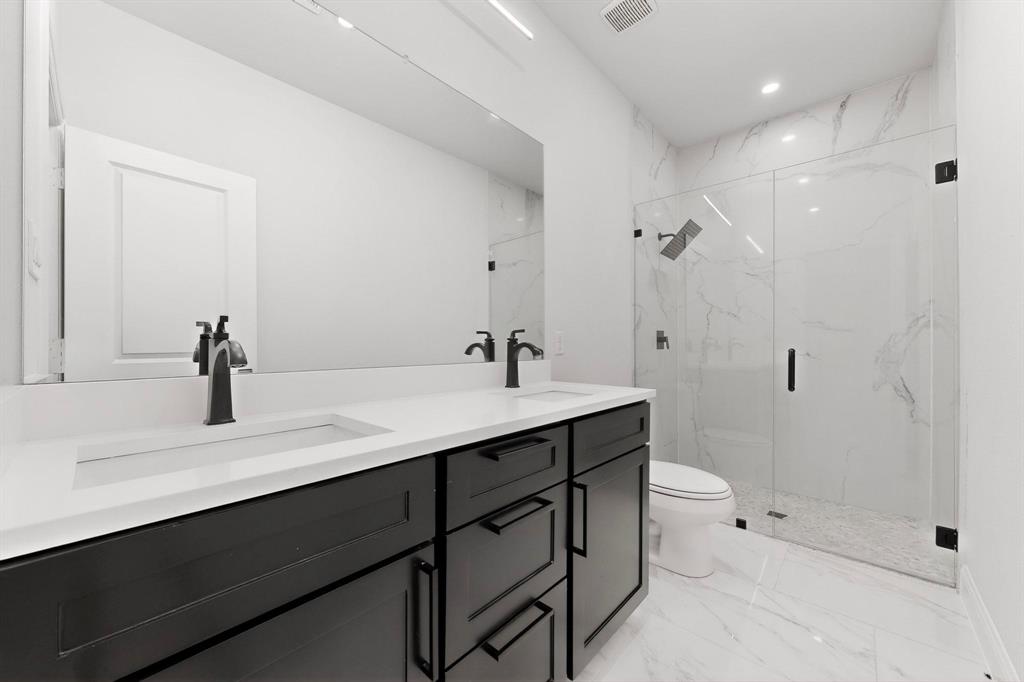 404 Luzon Street Tool, TX 75143 - Photo 29 of 40 a bathroom with a sink a toilet and shower