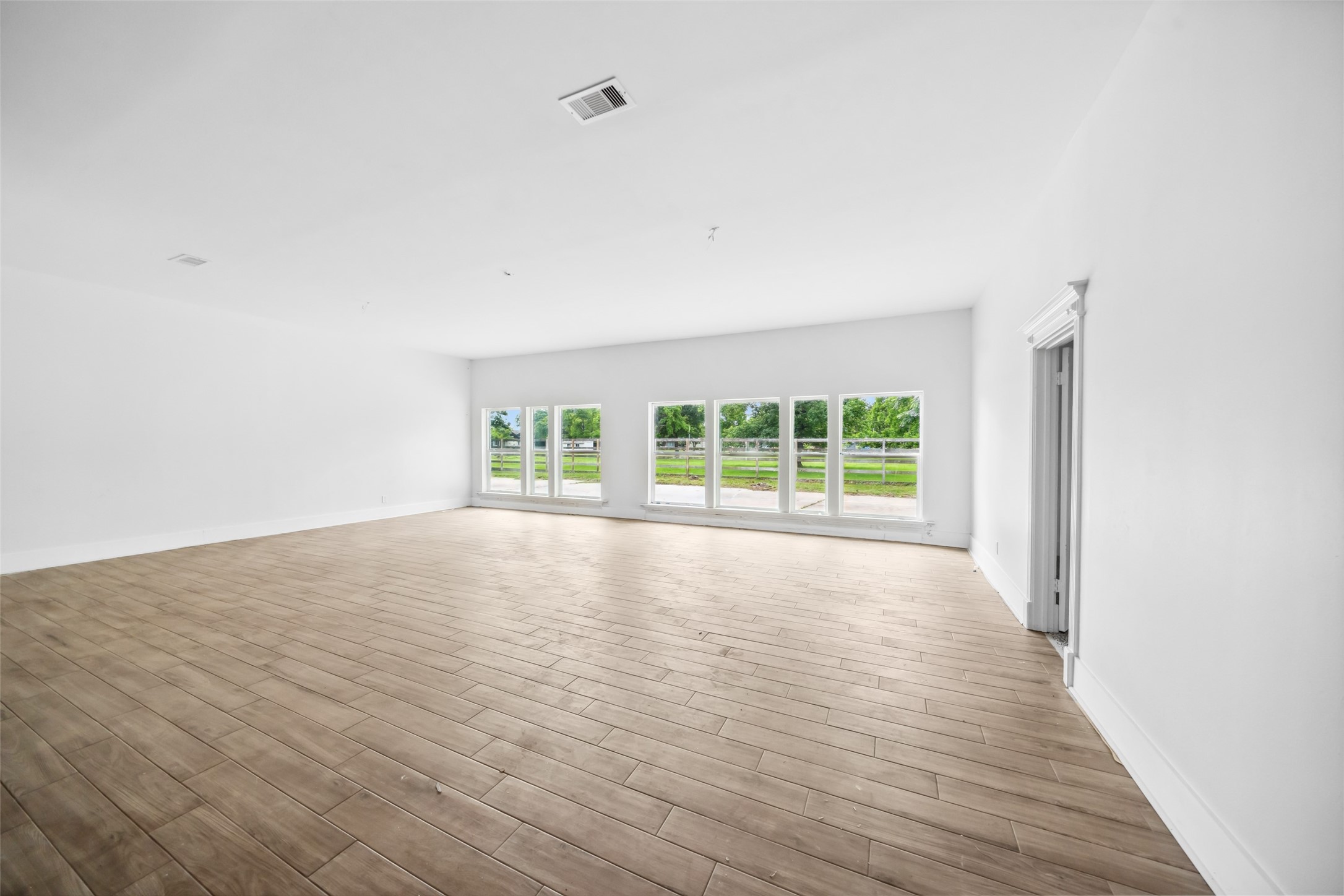 21310 Rosehill Church Road Tomball, TX 77377 - Photo 16 of 37 wooden floor in an empty room with a window