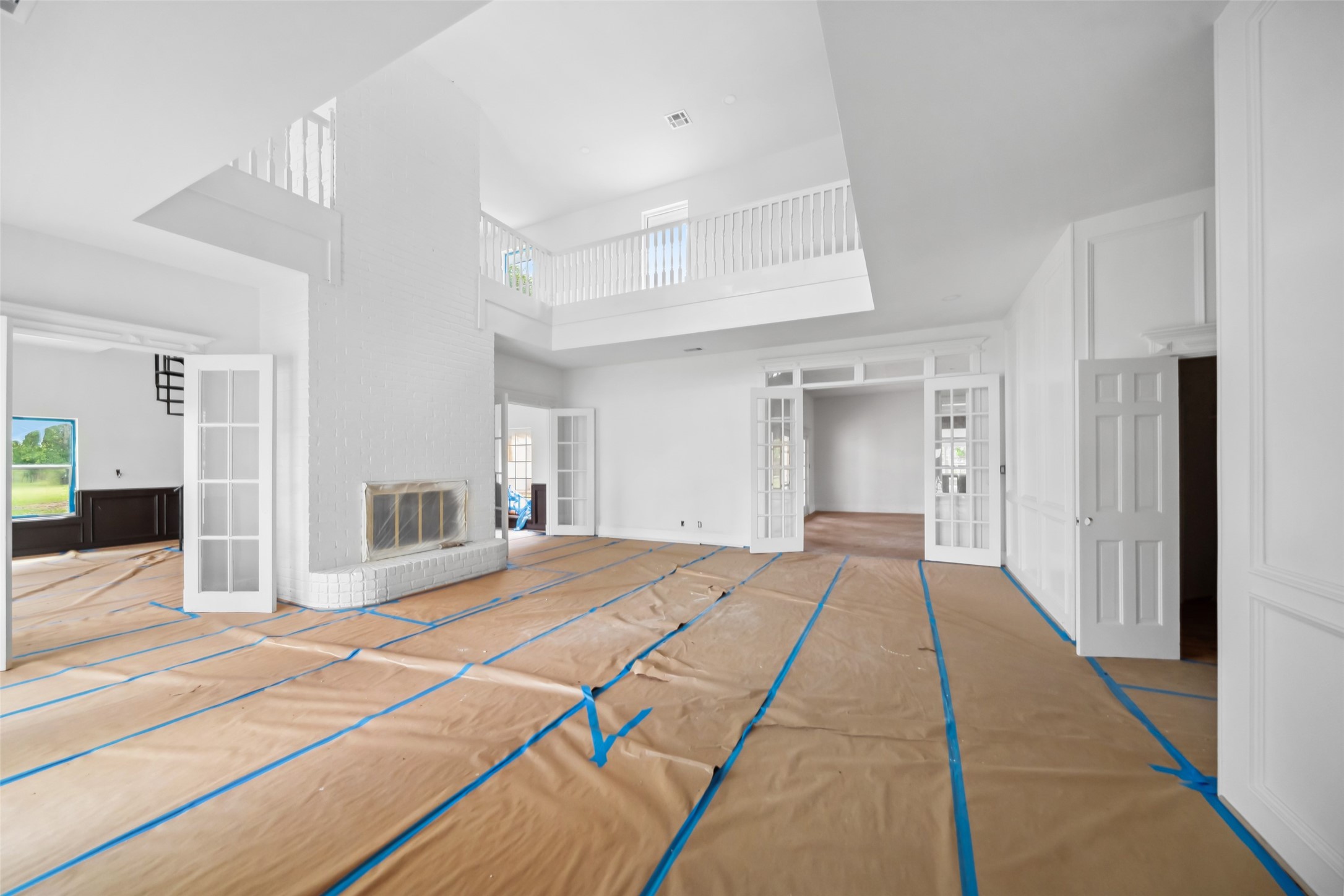 21310 Rosehill Church Road Tomball, TX 77377 - Photo 18 of 37 a view of a livingroom with wooden floor and a kitchen