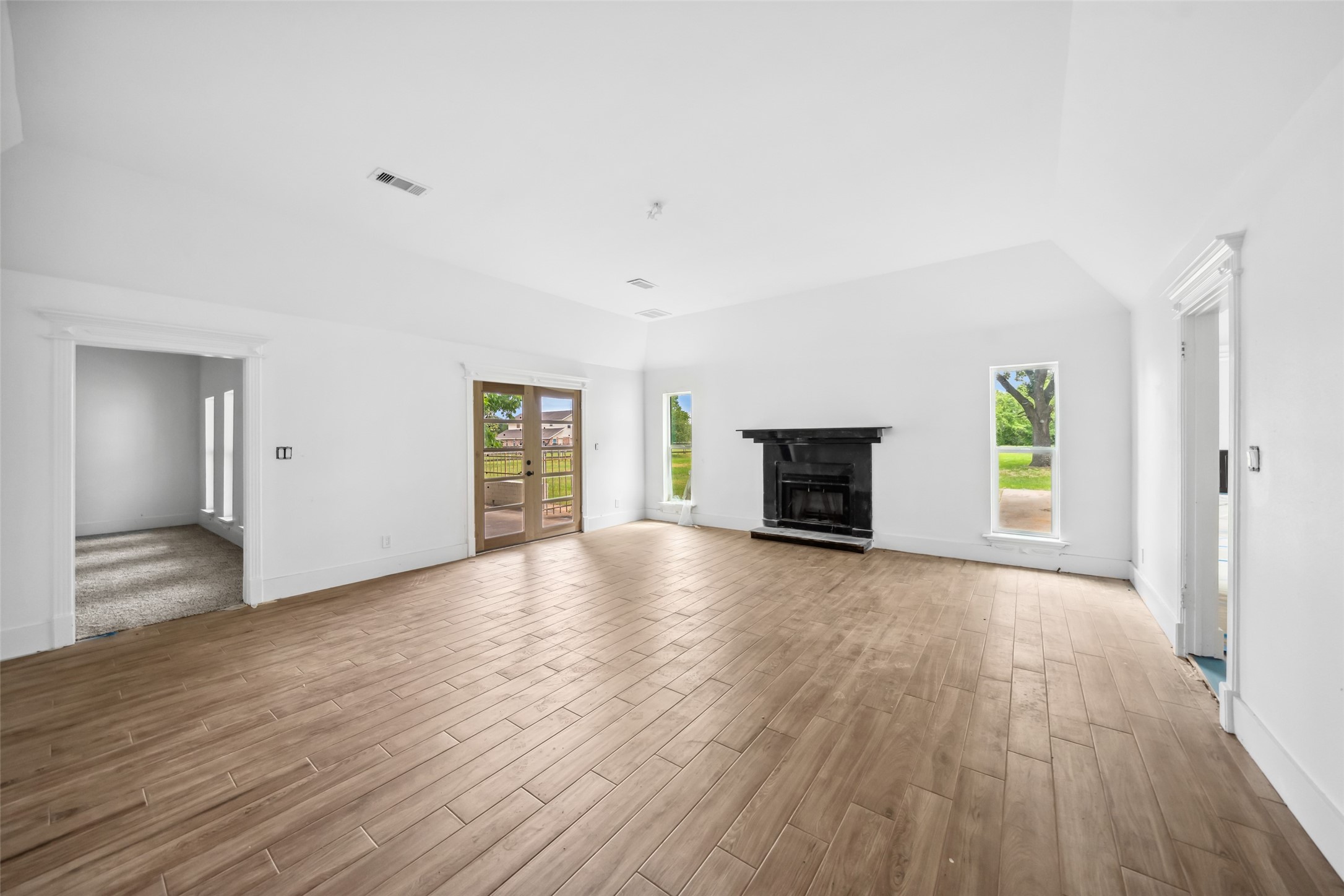 21310 Rosehill Church Road Tomball, TX 77377 - Photo 19 of 37 a view of an empty room with wooden floor and a window