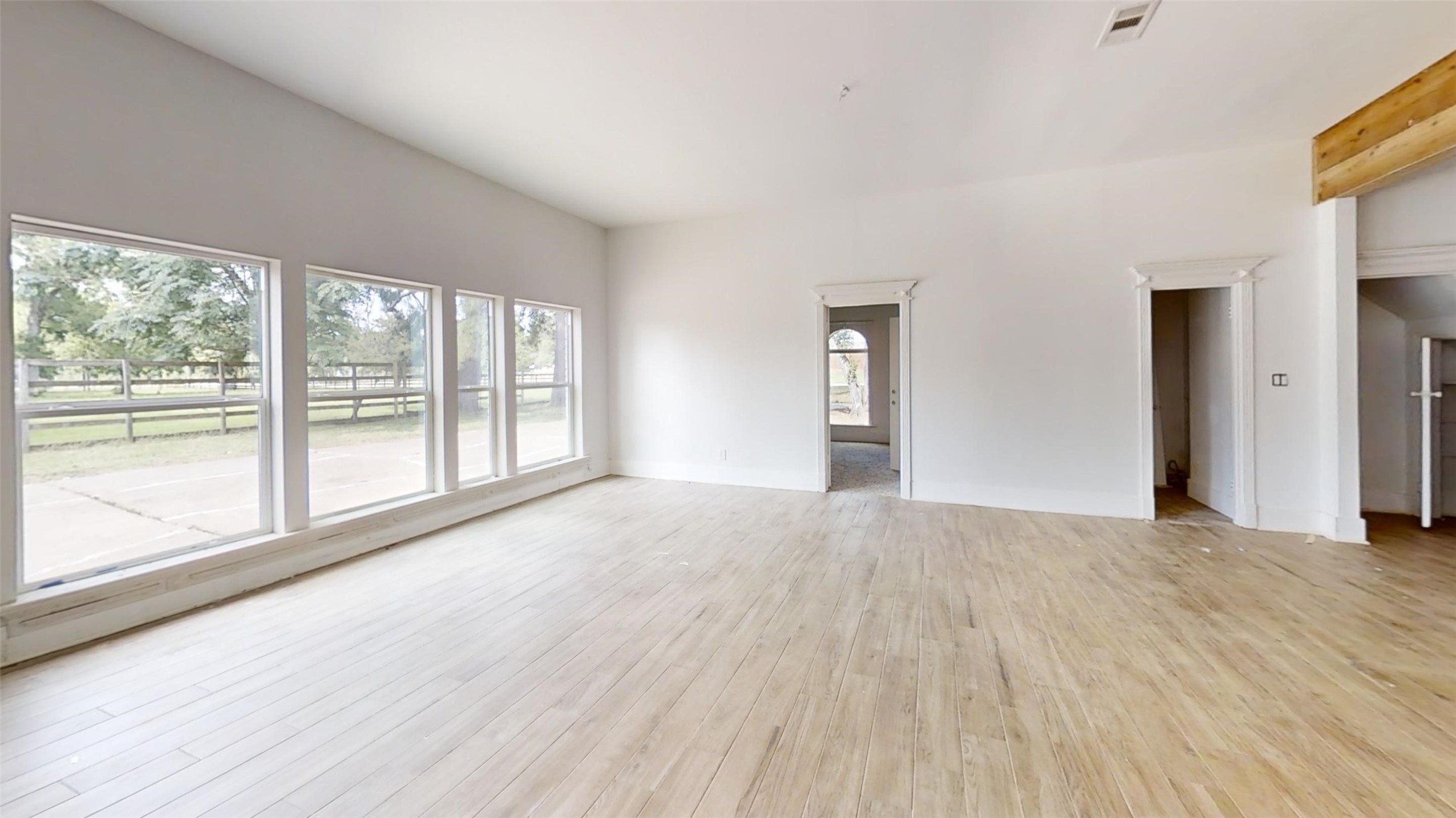 21310 Rosehill Church Road Tomball, TX 77377 - Photo 37 of 37 a view of an empty room with wooden floor and a window
