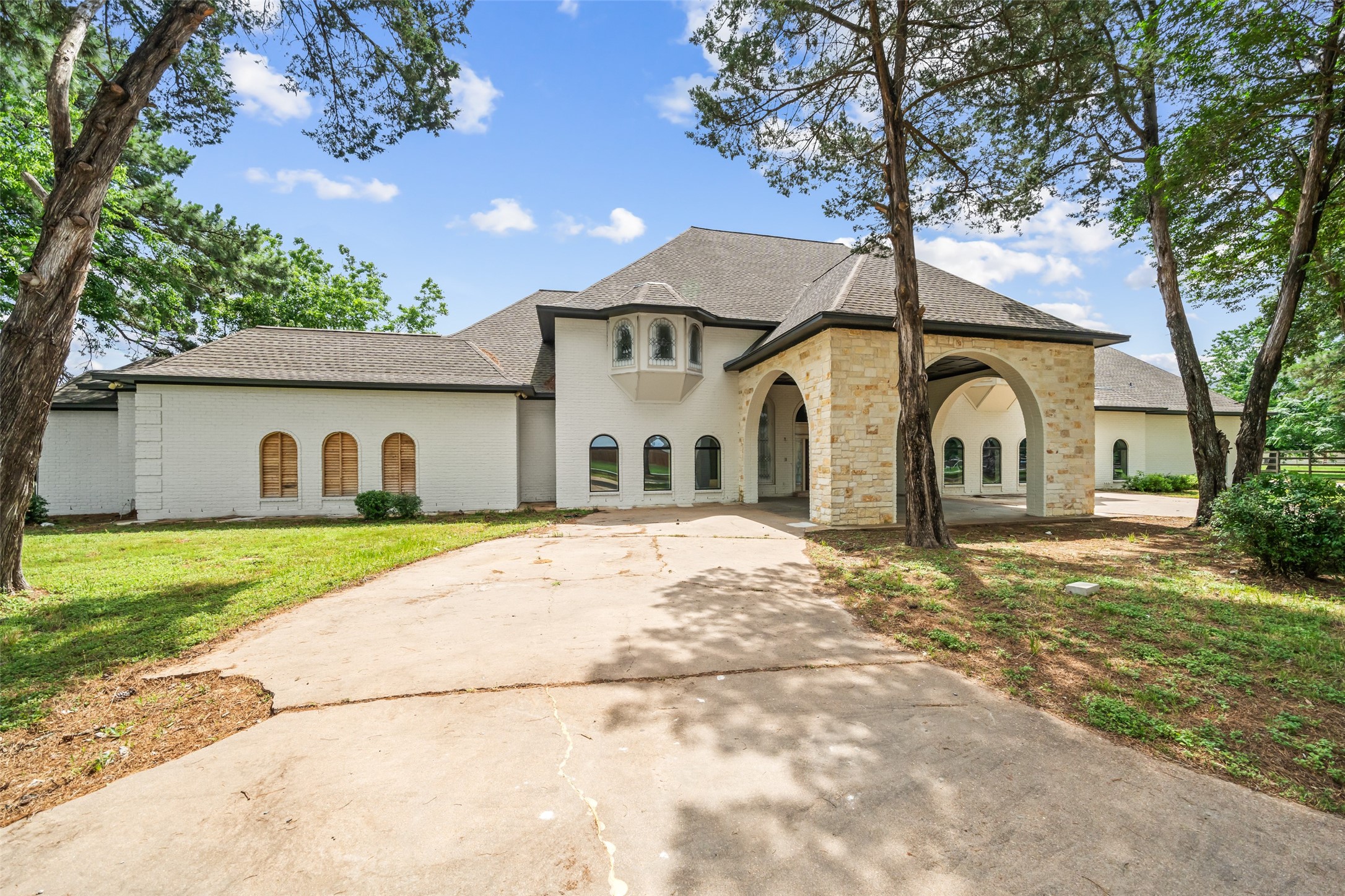 21310 Rosehill Church Road Tomball, TX 77377 - Photo 7 of 37 a front view of a house with a yard and garage