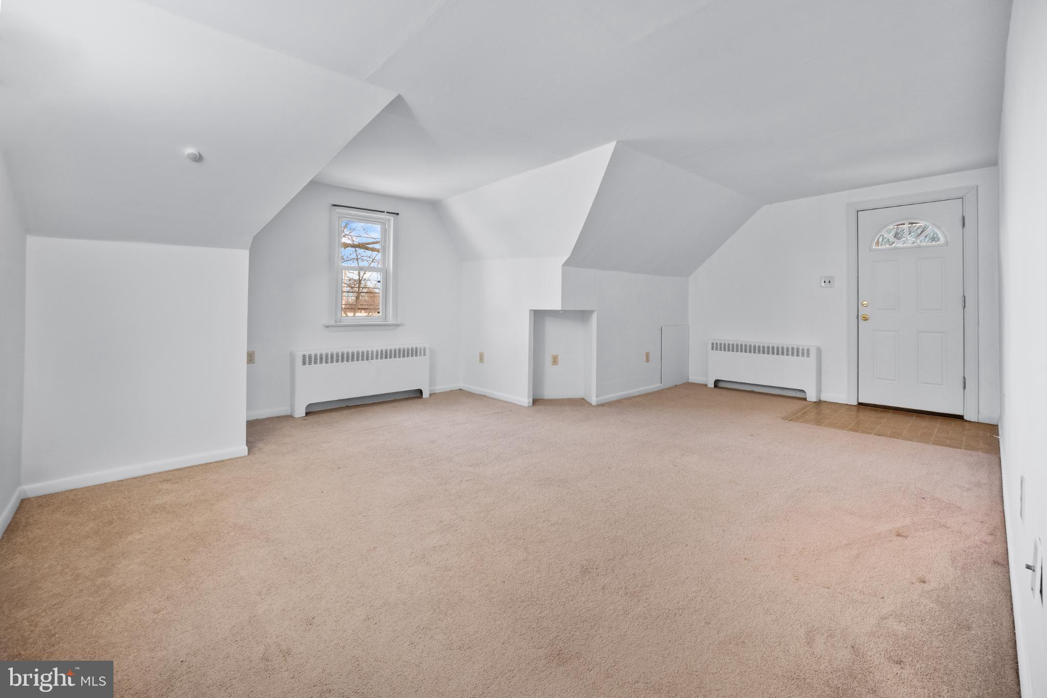 Spacious attic retreat with natural light.