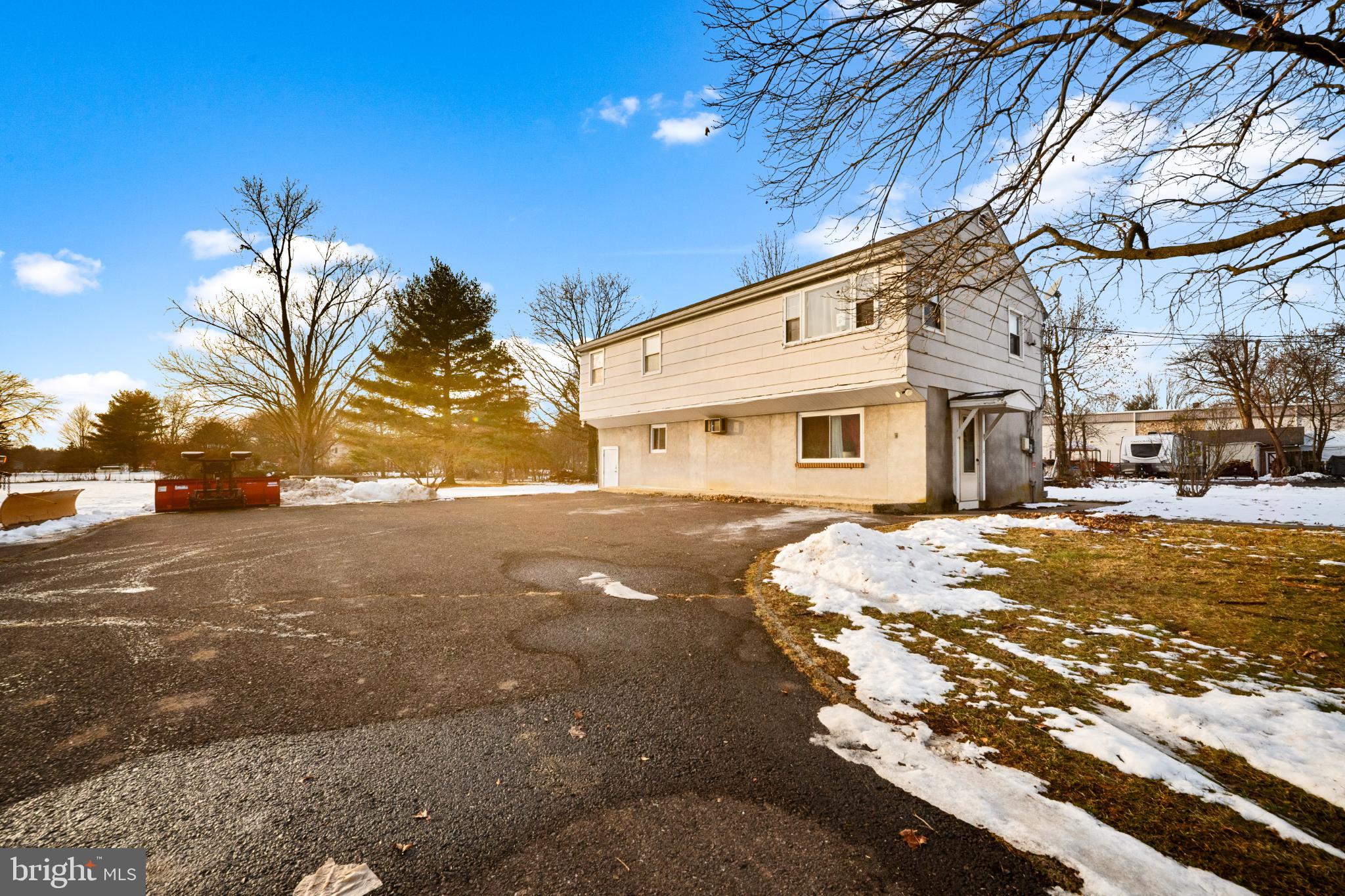 842 Bethlehem Pike, Unit B Colmar, PA 18915 - Photo 2 of 13 a front view of a house with a yard