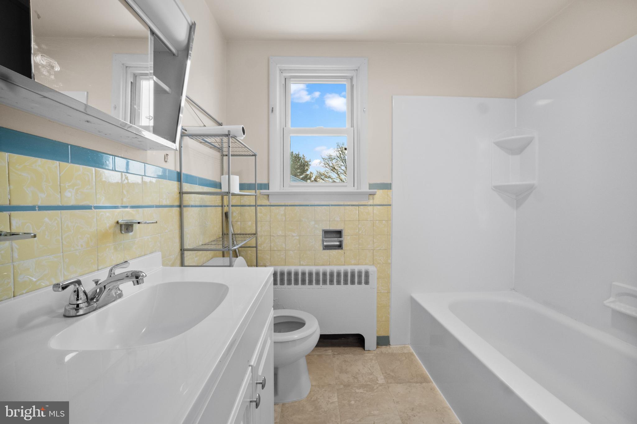 842 Bethlehem Pike, Unit B Colmar, PA 18915 - Photo 10 of 13 a bathroom with a sink a toilet and a bathtub