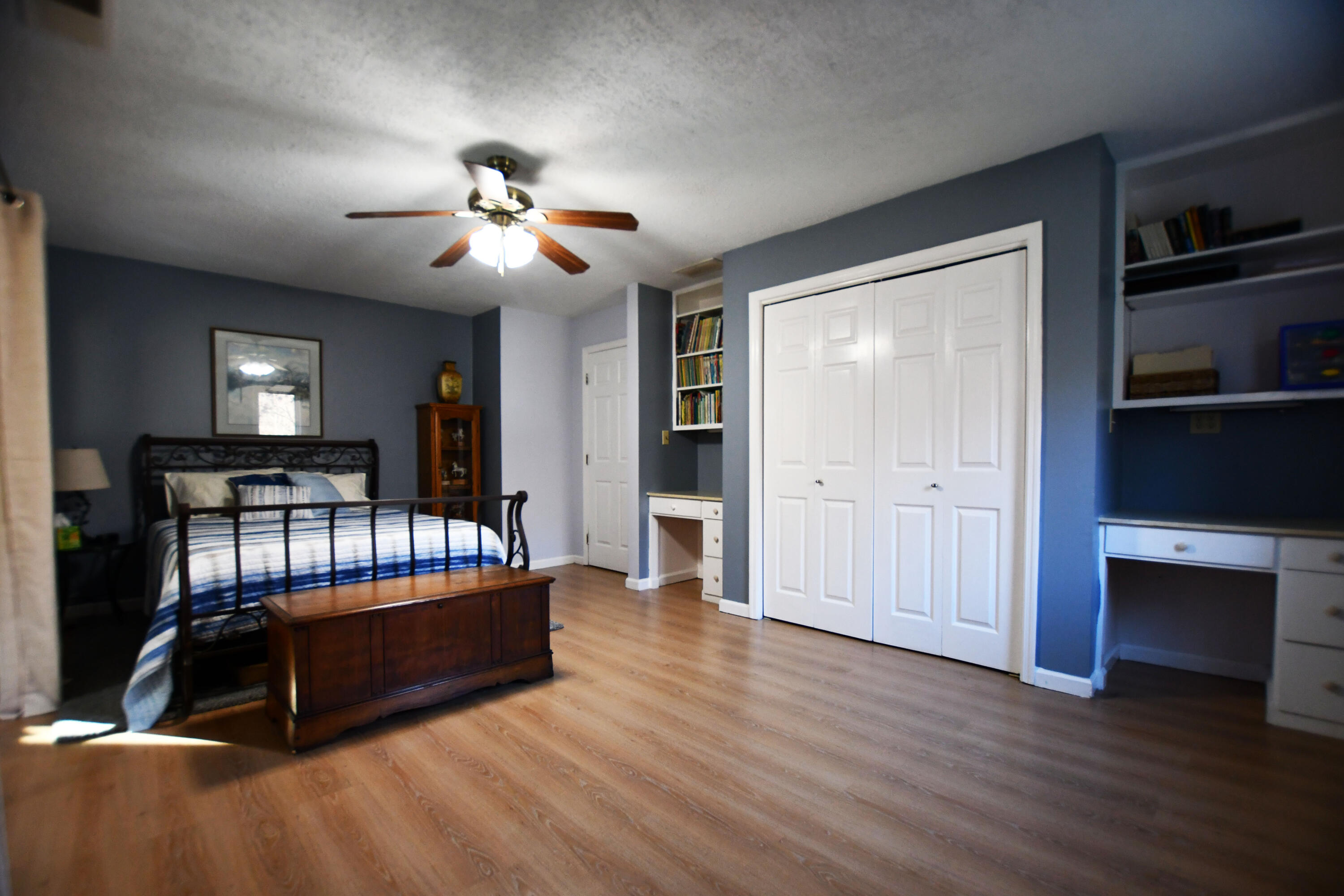 820 Sweet Lick Road Ravenna, KY 40472 - Photo 46 of 73 Bright second bedroom featuring a private balcony, built-ins, and plenty of space to relax!