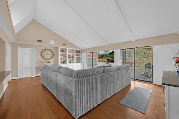 a view of a living room and entry way