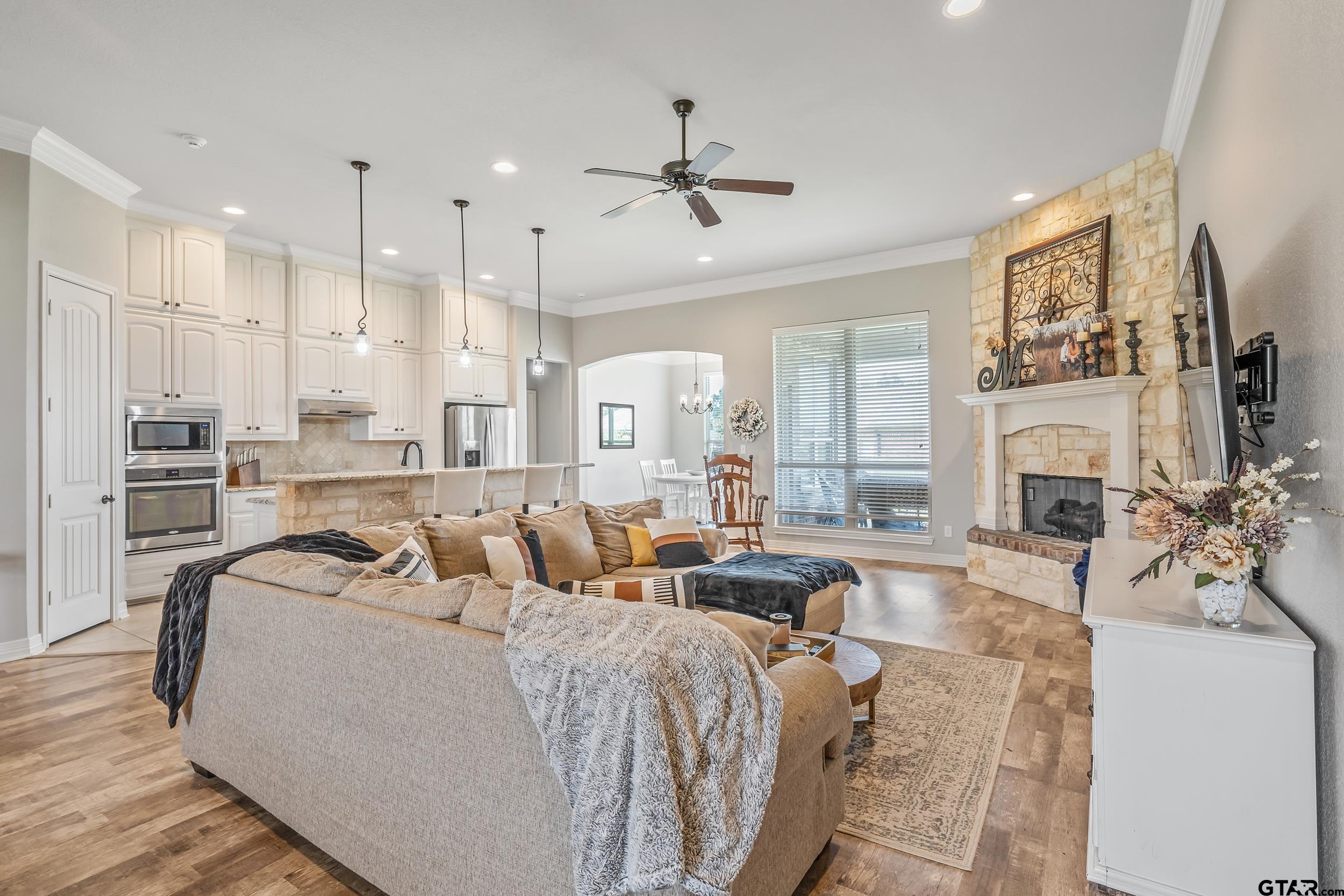 11775 Belle Chase Tyler, TX 75703 - Photo 11 of 28 a living room with fireplace furniture and a fireplace