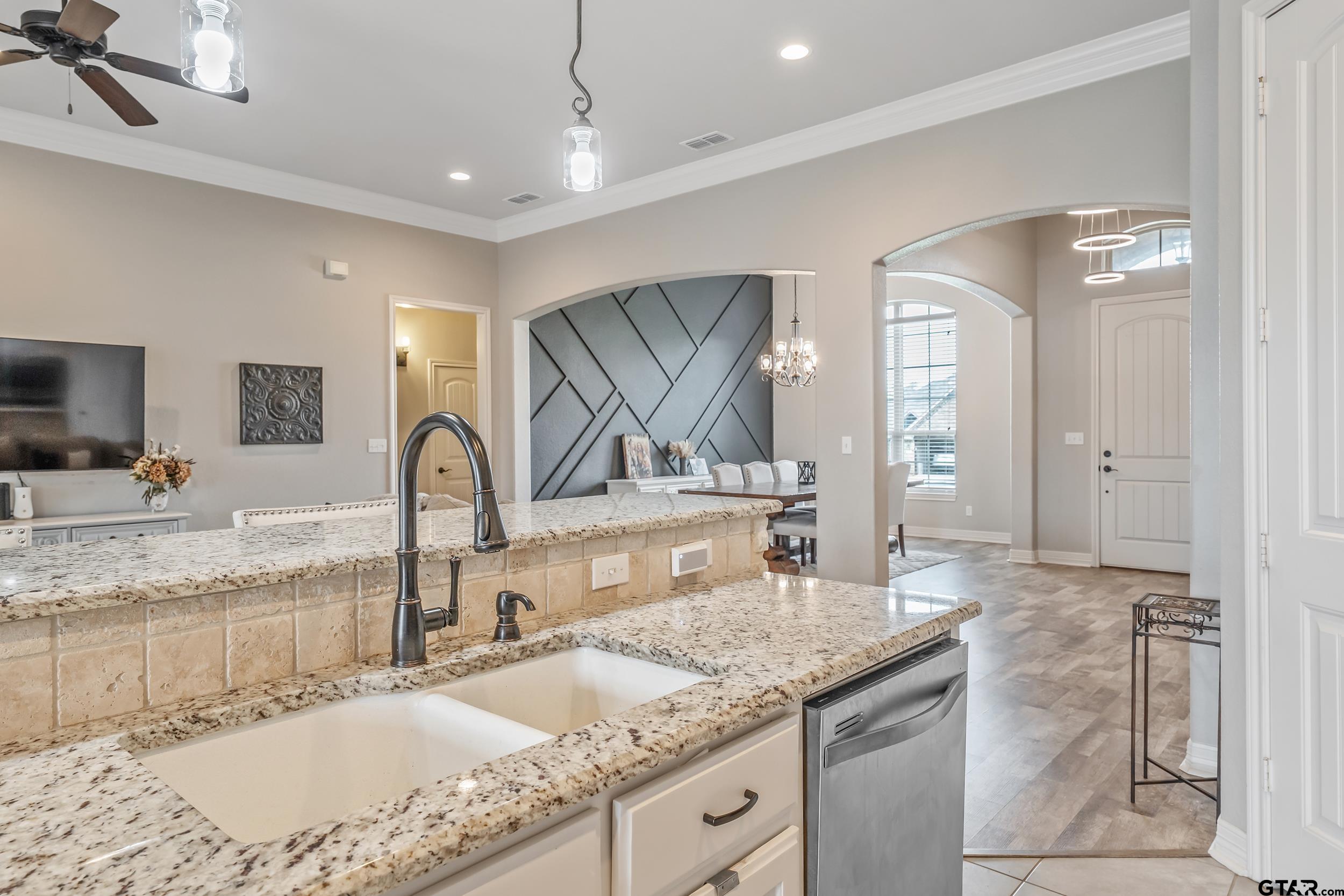 11775 Belle Chase Tyler, TX 75703 - Photo 6 of 28 a bathroom with a granite countertop sink a mirror and shower