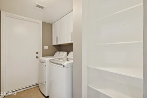 a large house with a big yard and large trees