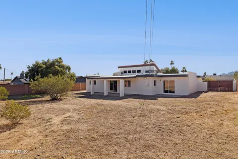 a view of a yard in front of a house with a yard