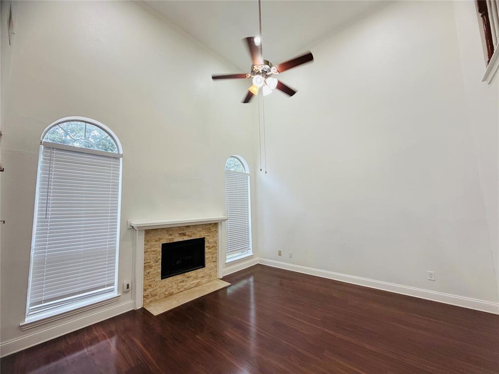 434 Moonlight Way Irving, TX 75063 - Photo 4 of 29 a view of a livingroom with wooden floor and a fireplace