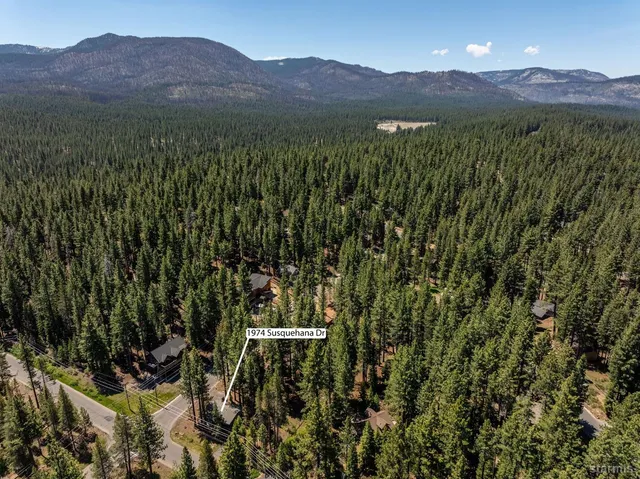 a view of a lush green hillside and a building