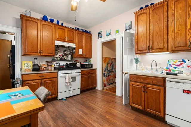 a room with a bed and a dresser