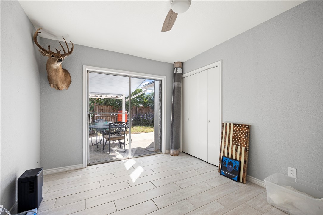 15730 Escapade Street Corpus Christi, TX 78418 - Photo 17 of 22 a room with furniture and a window