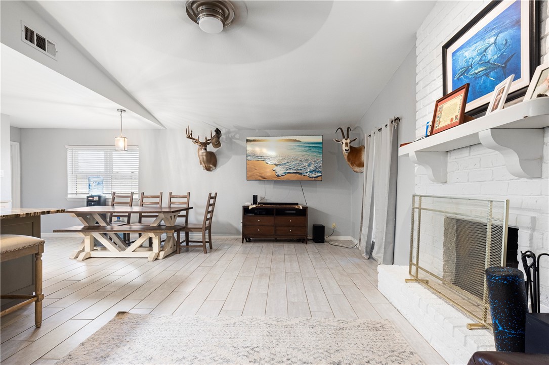 15730 Escapade Street Corpus Christi, TX 78418 - Photo 9 of 22 a living room with furniture and a fireplace