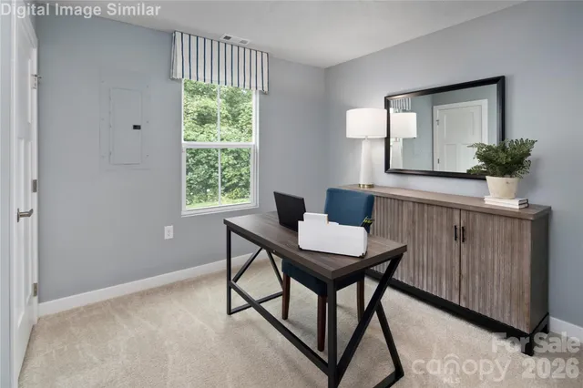 a workspace with furniture and a window