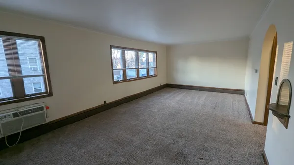 a view of an empty room with a window