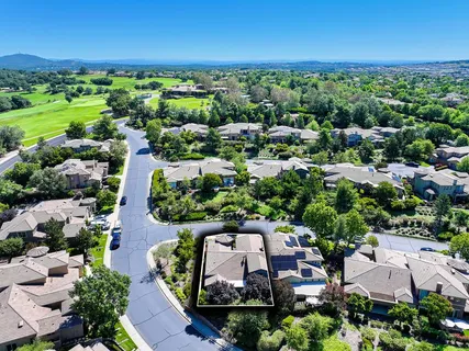 an aerial view of a house with a garden