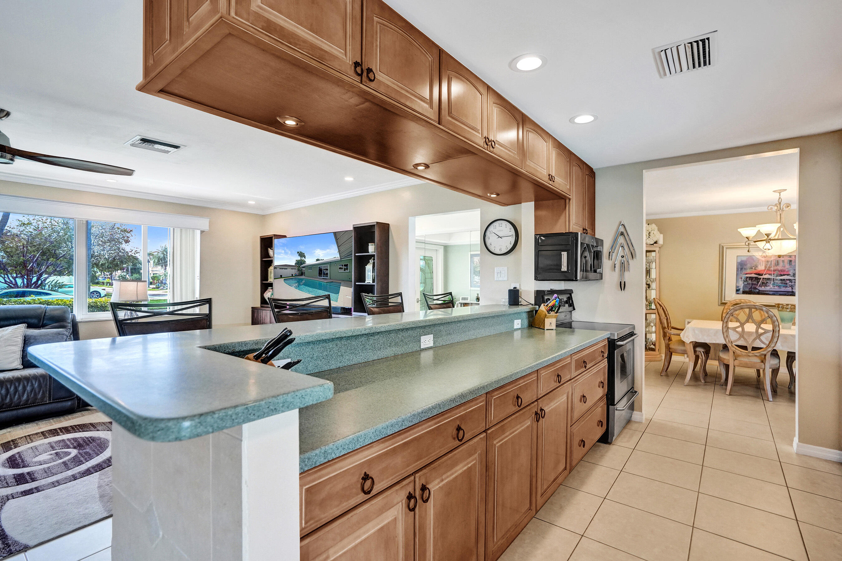 3001 Northeast 45th Street Lighthouse Point, FL 33064 - Photo 11 of 67 a large kitchen with stainless steel appliances lots of counter space