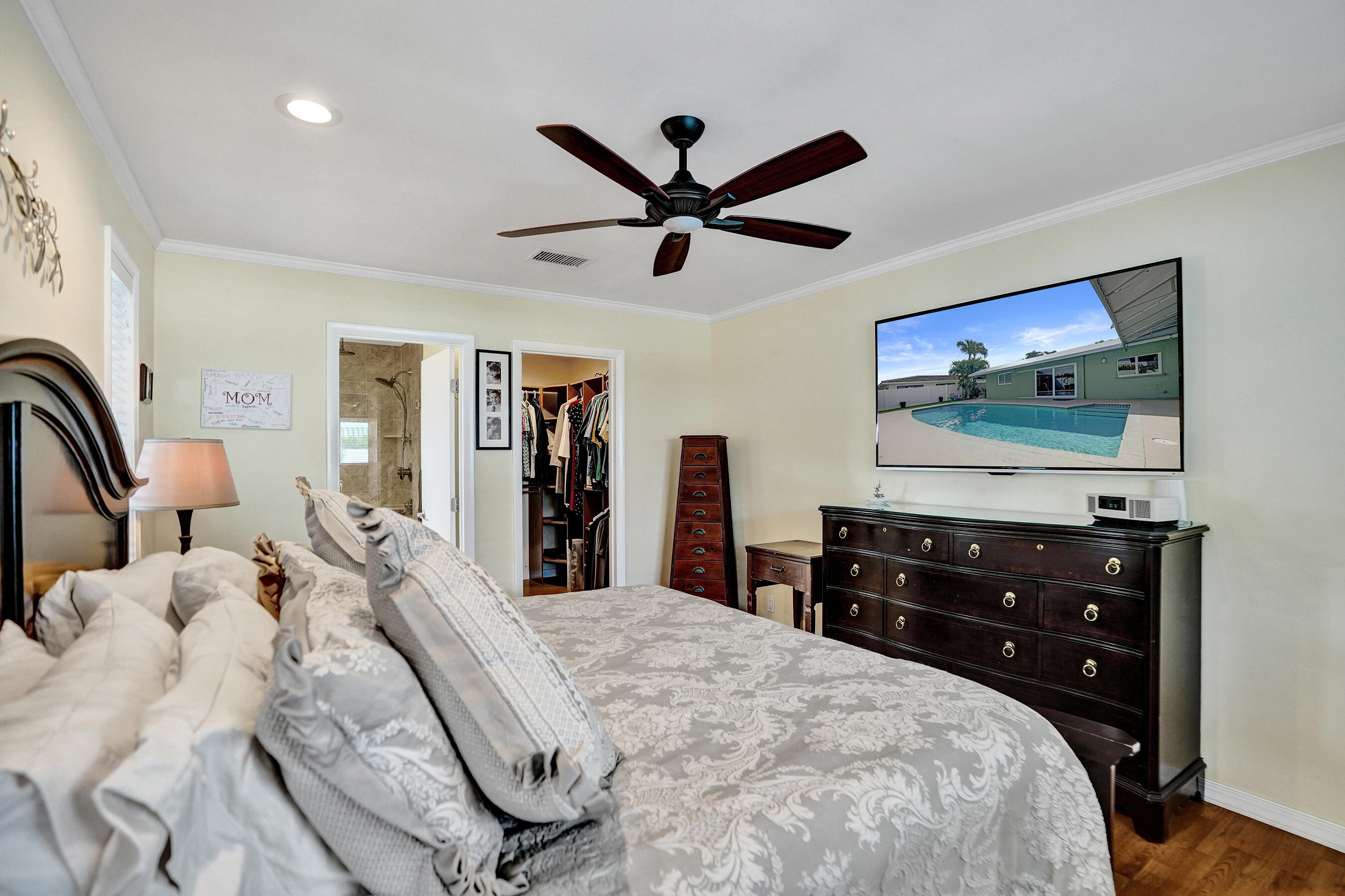 3001 Northeast 45th Street Lighthouse Point, FL 33064 - Photo 22 of 67 a bedroom with a bed and a flat screen tv