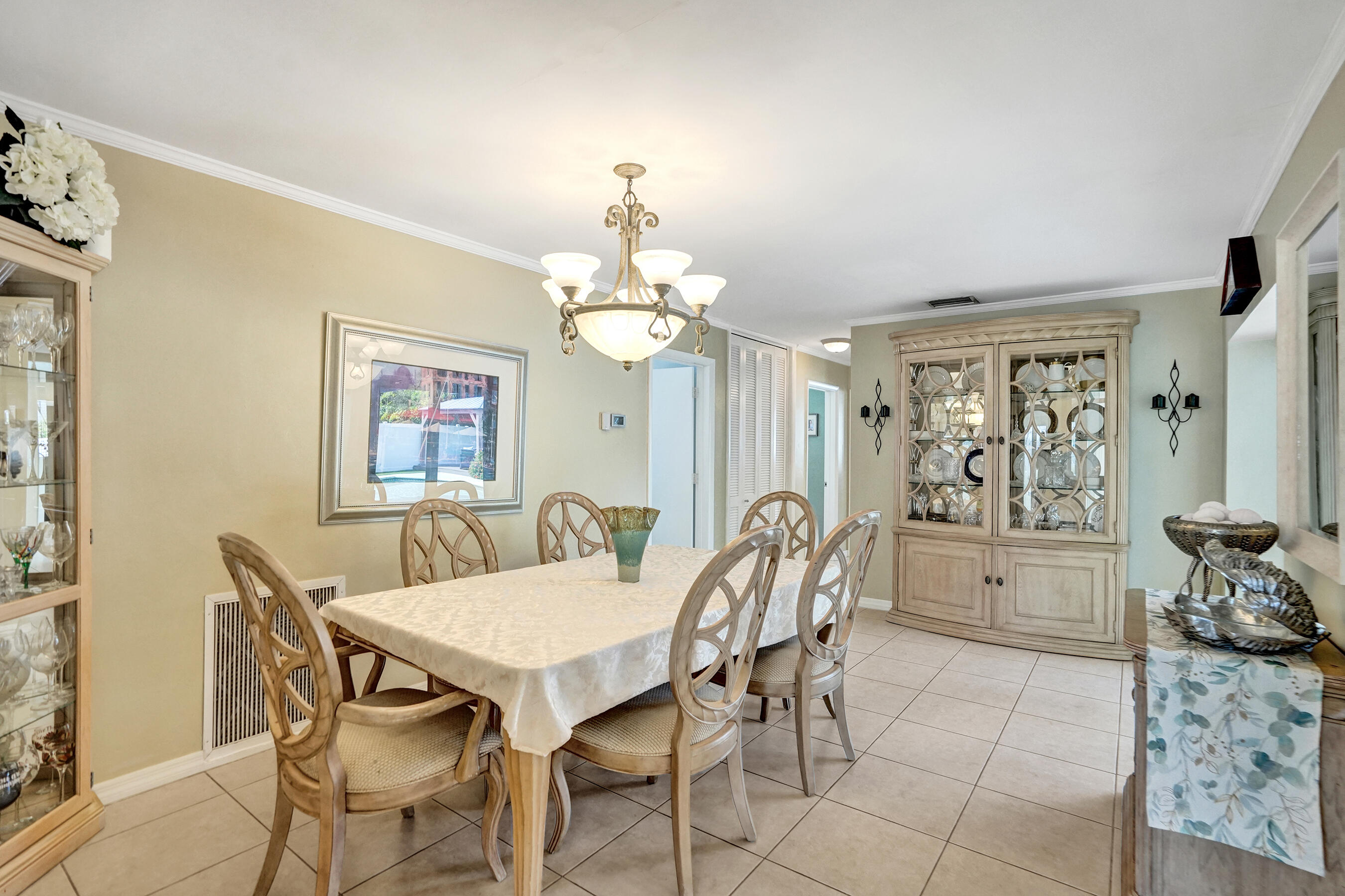 3001 Northeast 45th Street Lighthouse Point, FL 33064 - Photo 25 of 67 a view of a dining room with furniture and chandelier