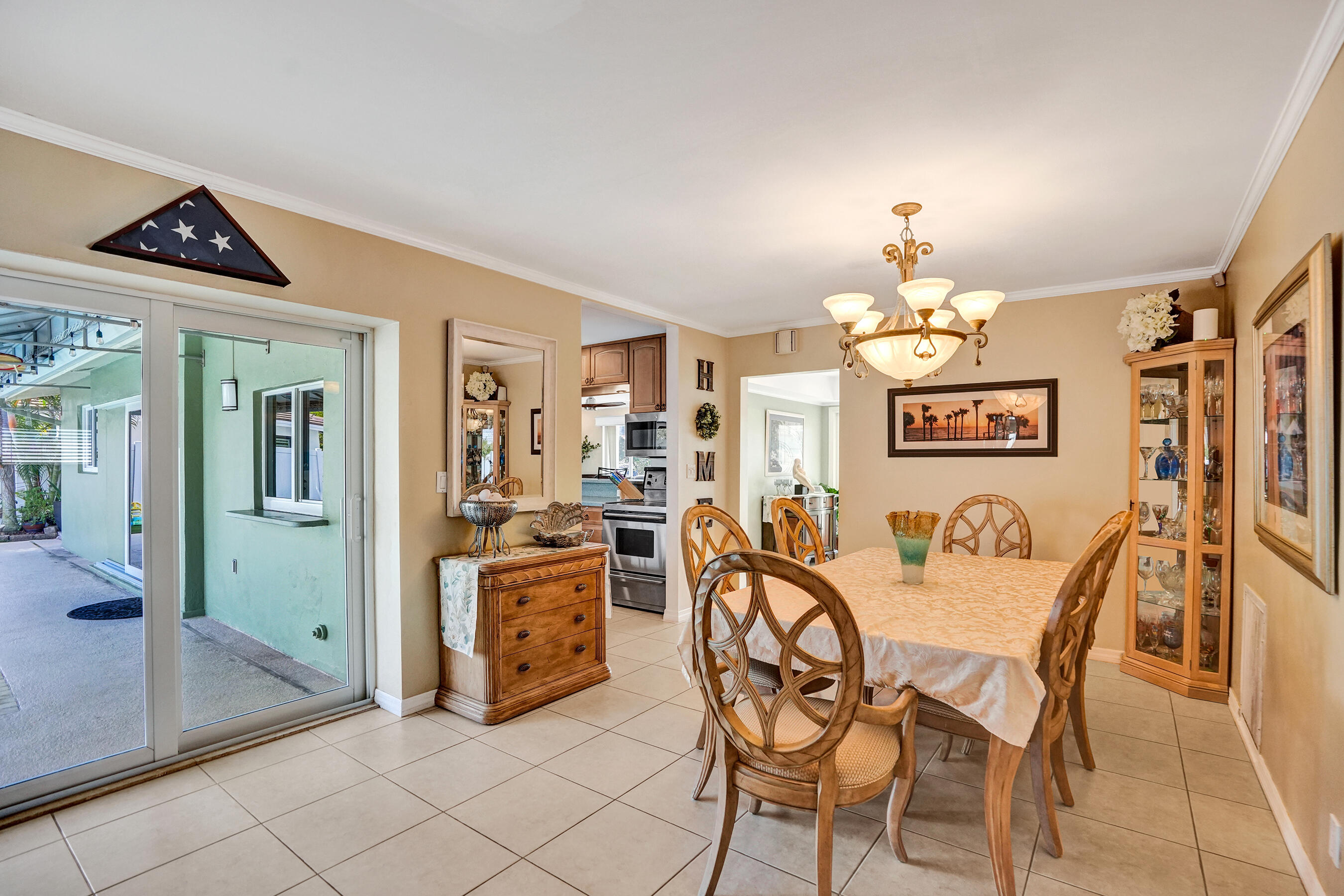 3001 Northeast 45th Street Lighthouse Point, FL 33064 - Photo 27 of 67 a view of a dining room with furniture and chandelier
