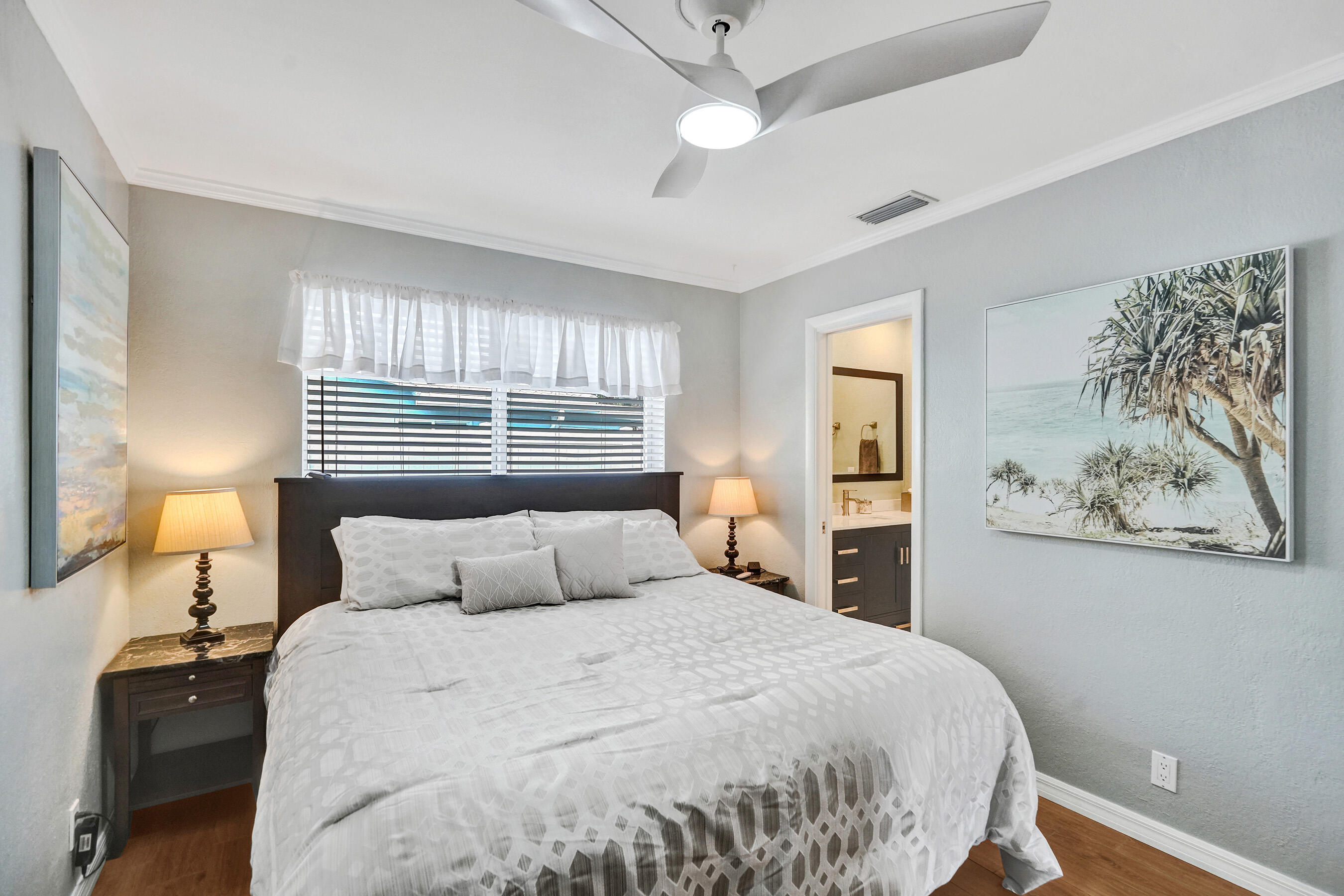 3001 Northeast 45th Street Lighthouse Point, FL 33064 - Photo 29 of 67 a bedroom with a large bed and a window
