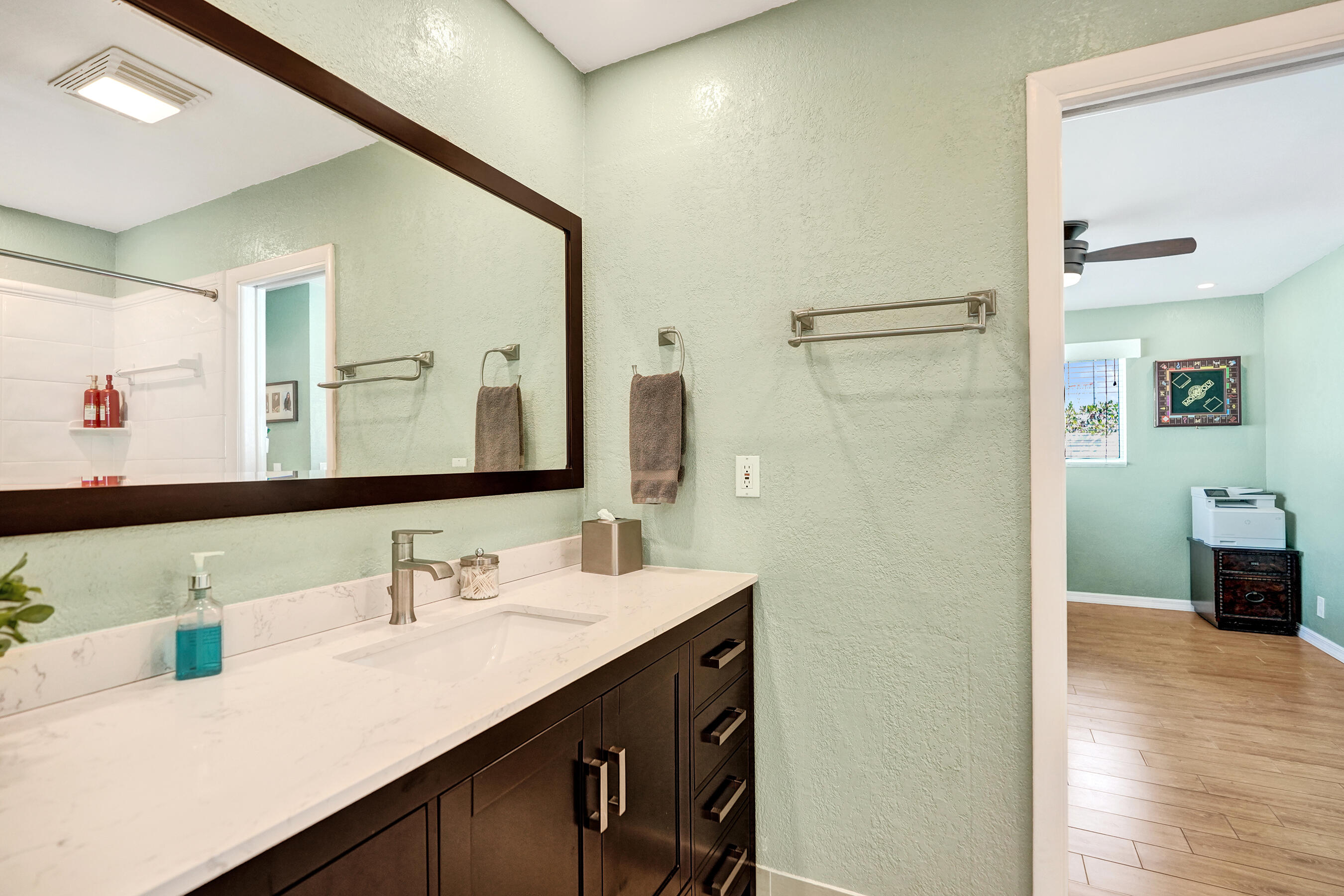 3001 Northeast 45th Street Lighthouse Point, FL 33064 - Photo 33 of 67 a bathroom with a sink and a mirror