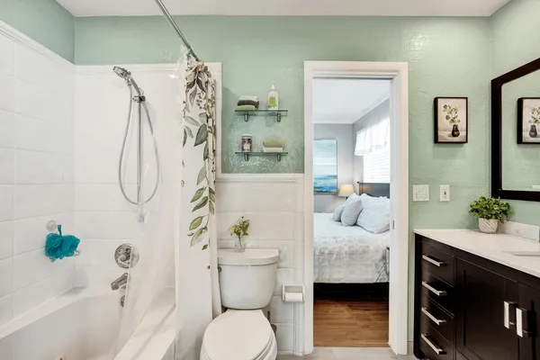 a bathroom with a glass shower door