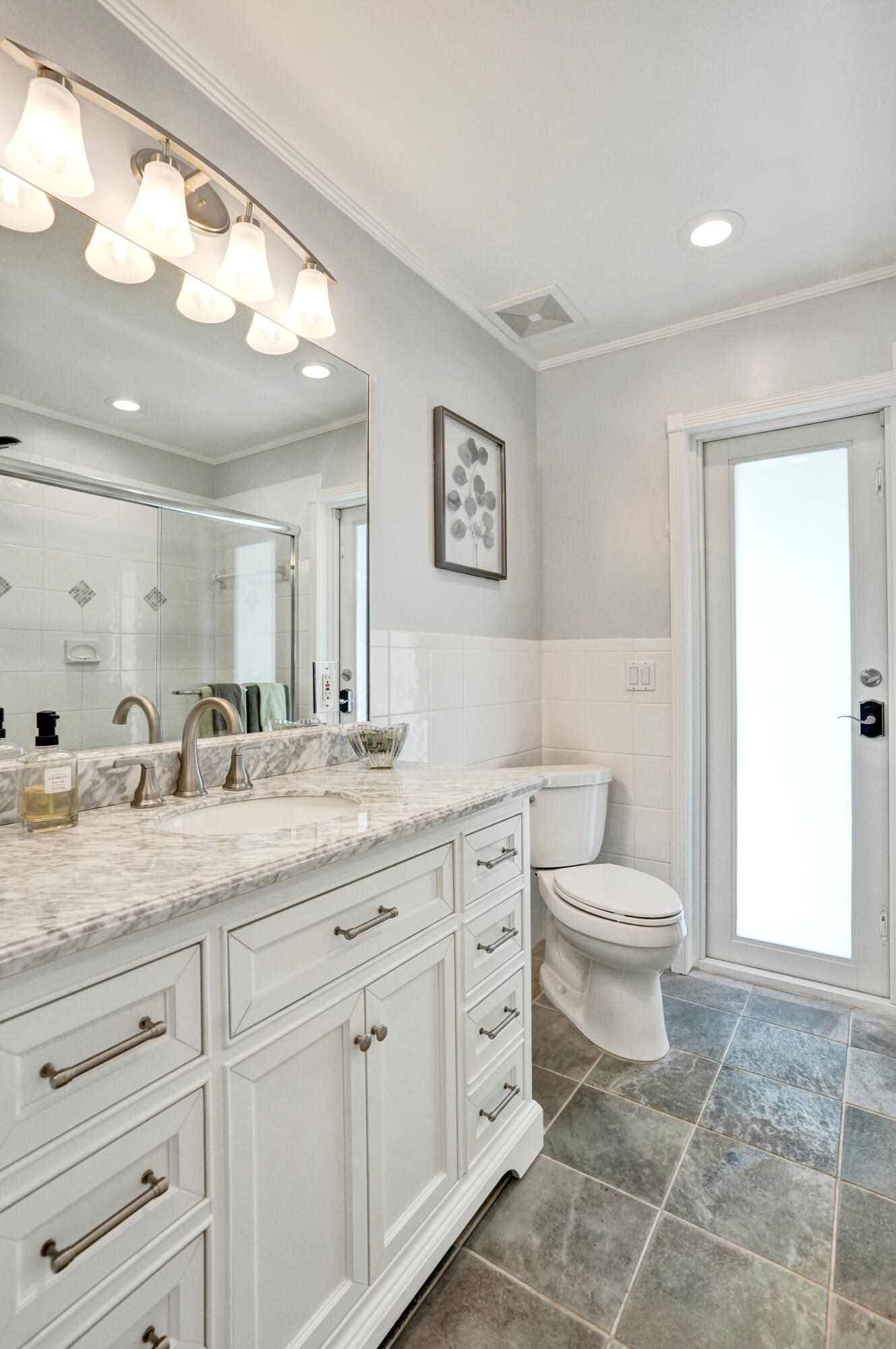 3001 Northeast 45th Street Lighthouse Point, FL 33064 - Photo 41 of 67 a bathroom with a granite countertop sink mirror vanity and toilet