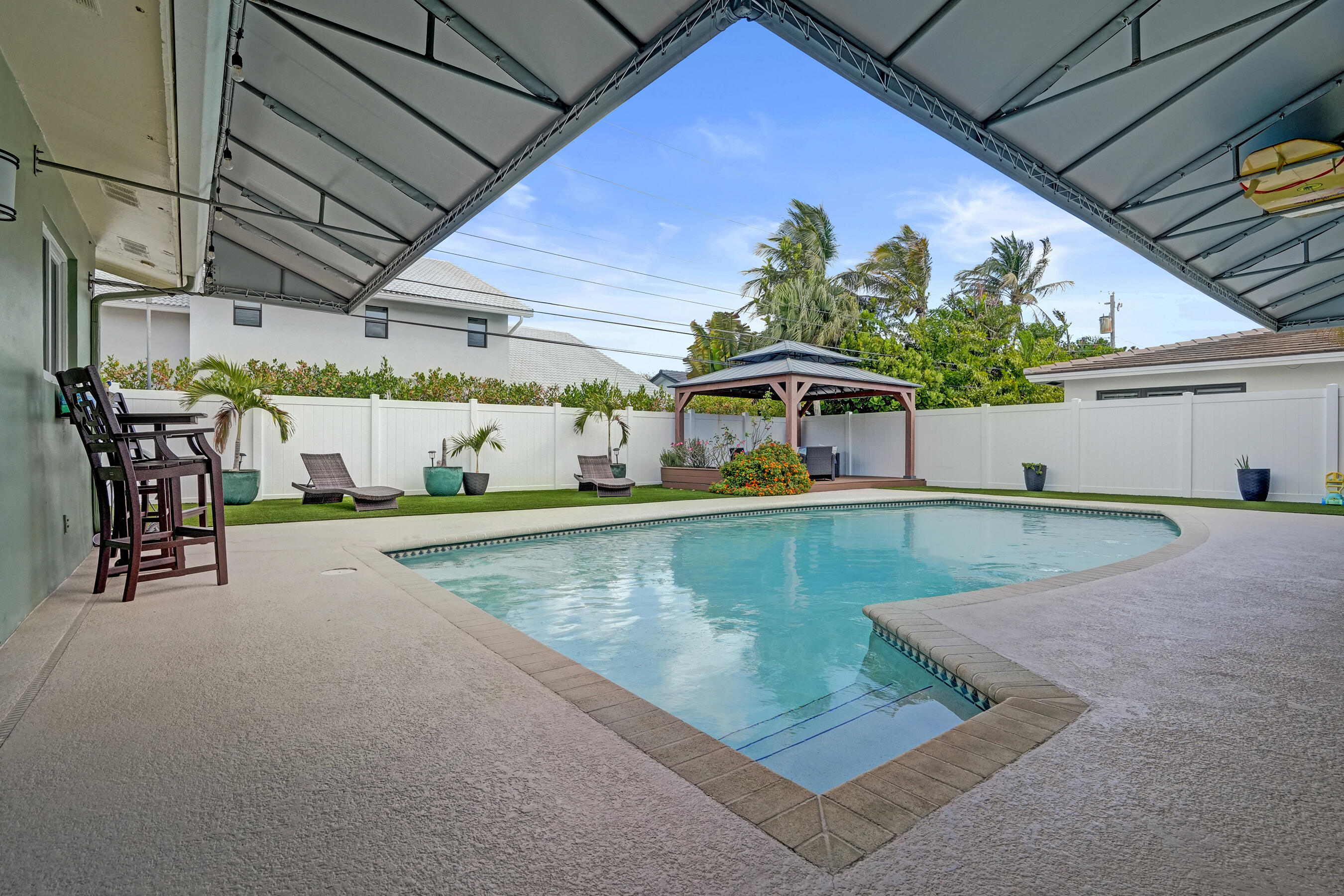 3001 Northeast 45th Street Lighthouse Point, FL 33064 - Photo 46 of 67 a view of a swimming pool with a patio