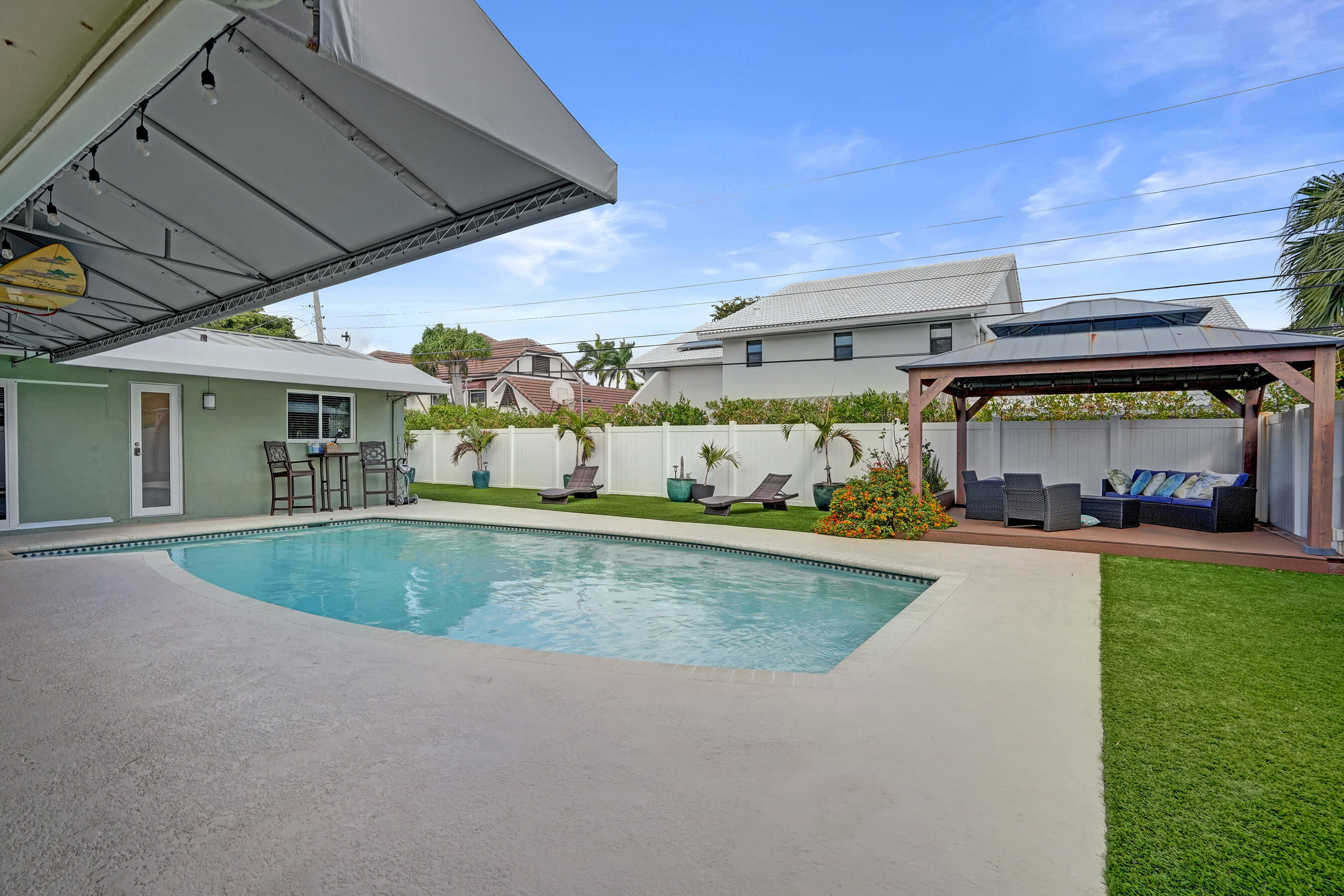 3001 Northeast 45th Street Lighthouse Point, FL 33064 - Photo 48 of 67 a view of swimming pool with outdoor seating