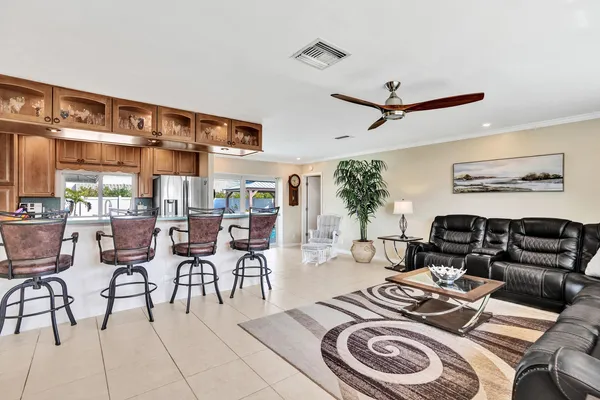 a living room with furniture a rug and a chandelier
