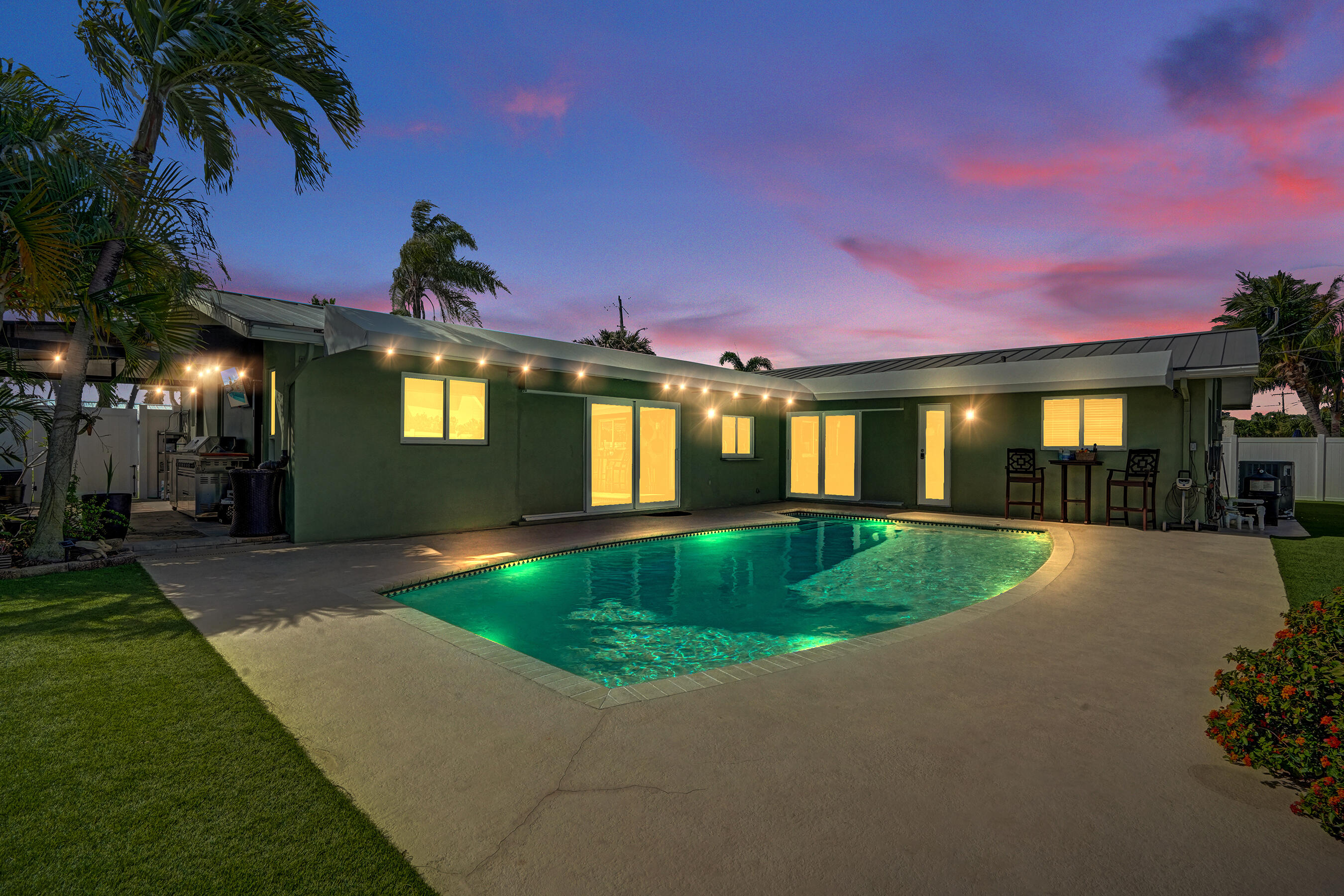 3001 Northeast 45th Street Lighthouse Point, FL 33064 - Photo 59 of 67 a view of a house with a swimming pool and a yard