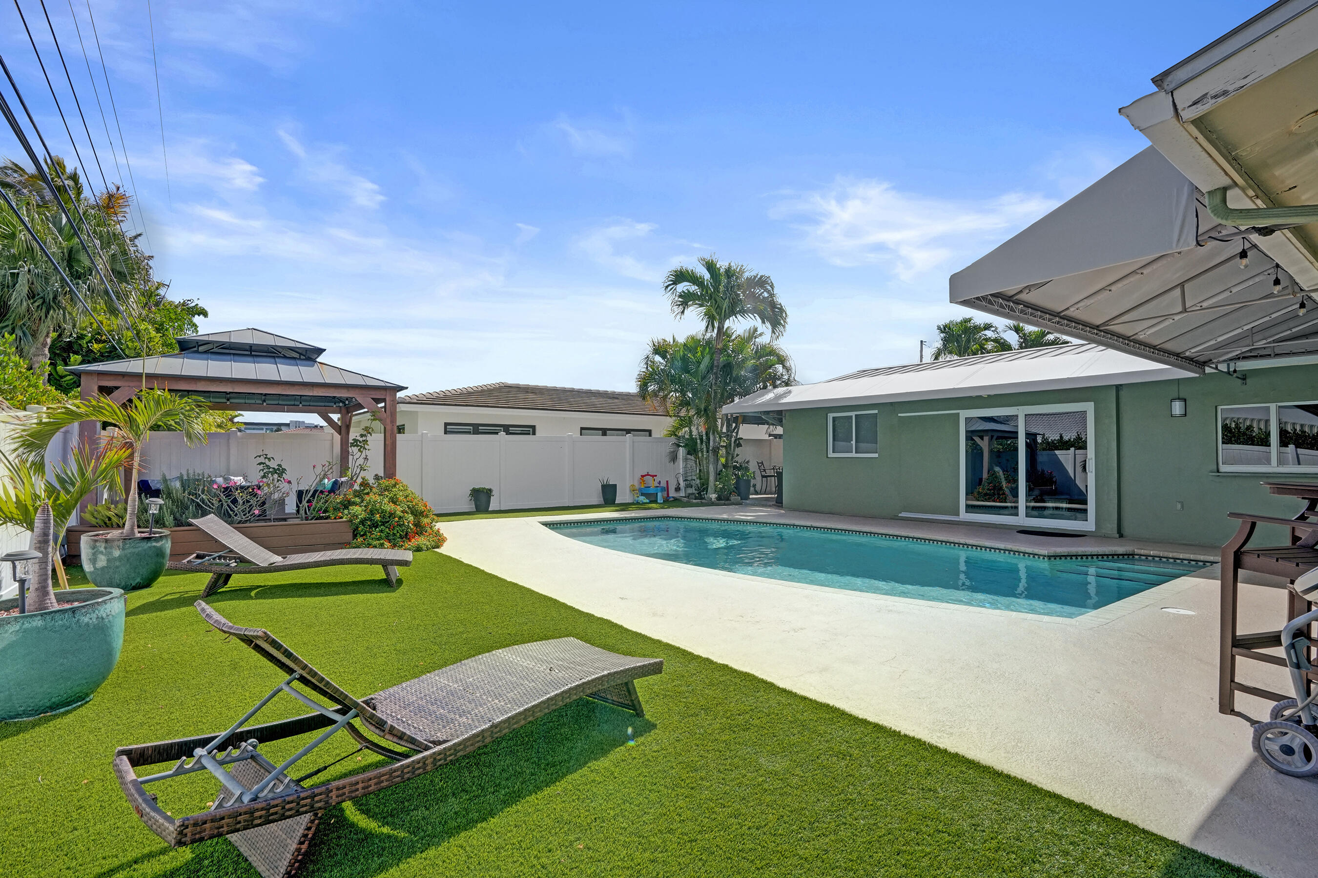 3001 Northeast 45th Street Lighthouse Point, FL 33064 - Photo 61 of 67 a view of a house with backyard and a tree