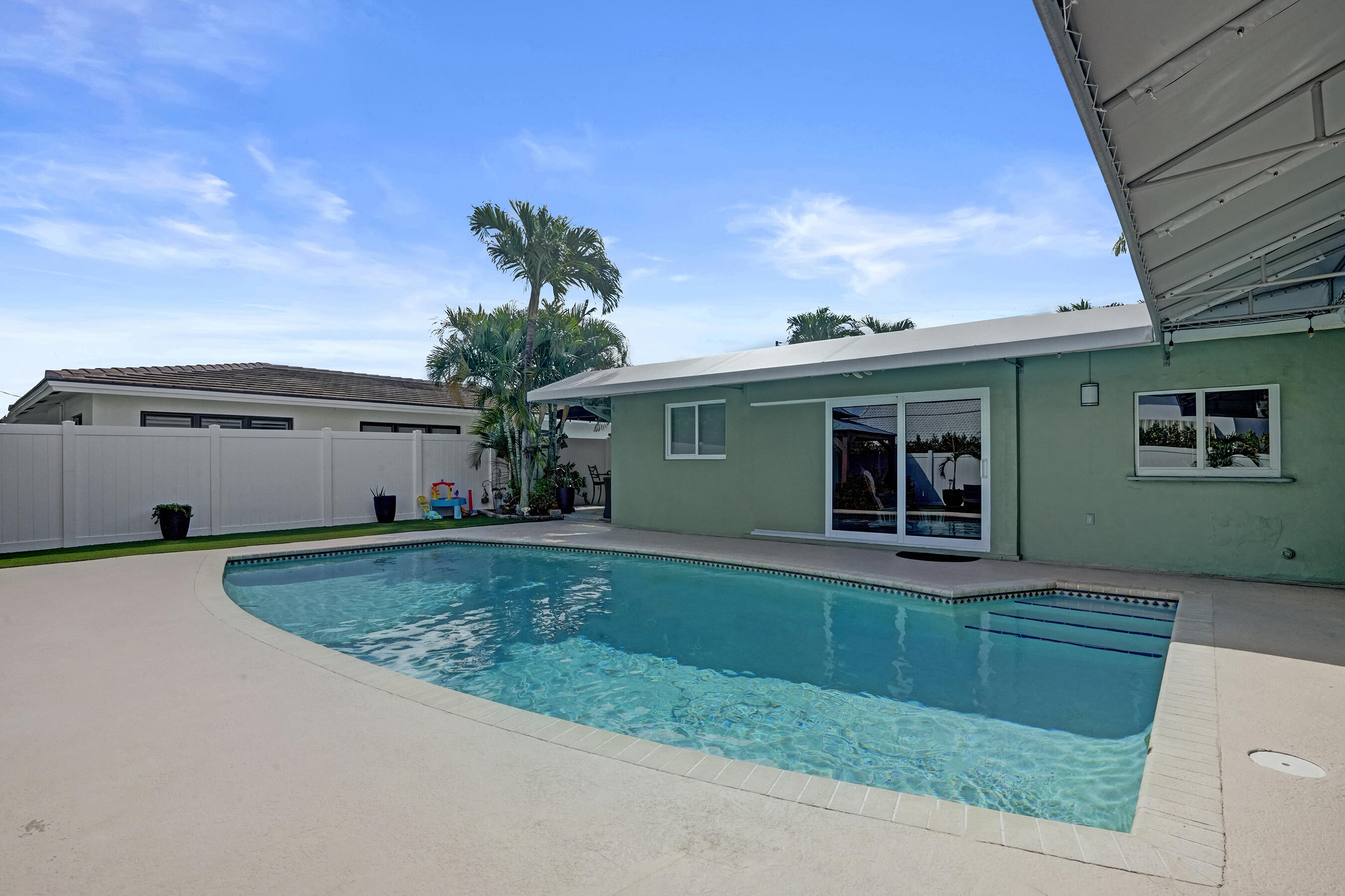 3001 Northeast 45th Street Lighthouse Point, FL 33064 - Photo 63 of 67 a view of a house with a yard