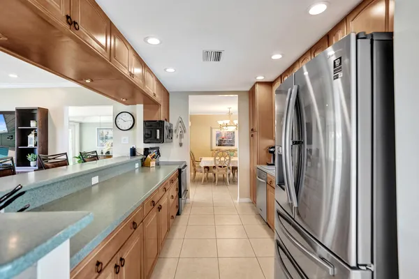 a large kitchen with stainless steel appliances lots of counter space