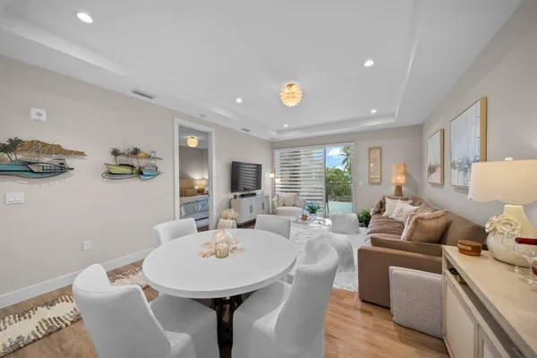 a view of a dining room with furniture and wooden floor