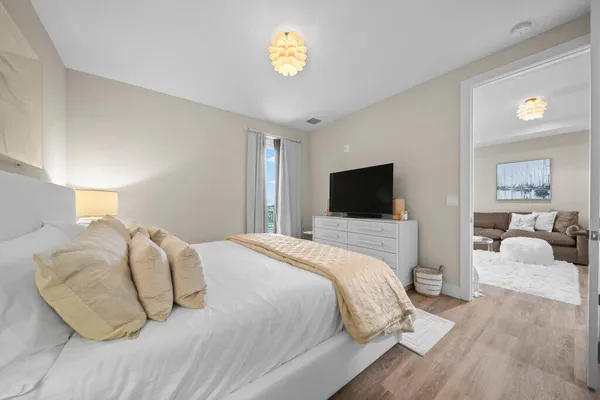 a bedroom with a bed and a couch