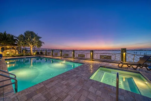 a view of a swimming pool with an outdoor seating