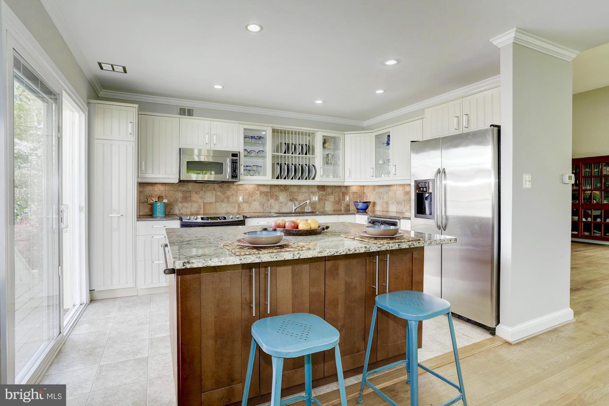 5011 Rodman Road Bethesda, MD 20816 - Photo 4 of 25 a kitchen with stainless steel appliances granite countertop a stove a sink a refrigerator and a refrigerator