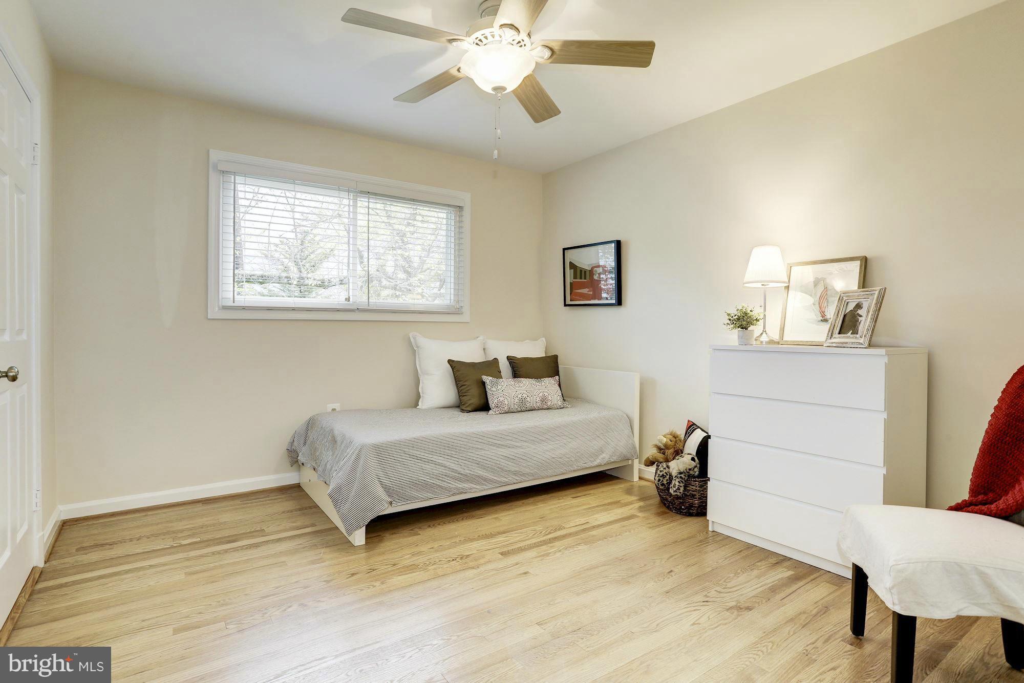 5011 Rodman Road Bethesda, MD 20816 - Photo 9 of 25 a living room with a bed furniture and a window