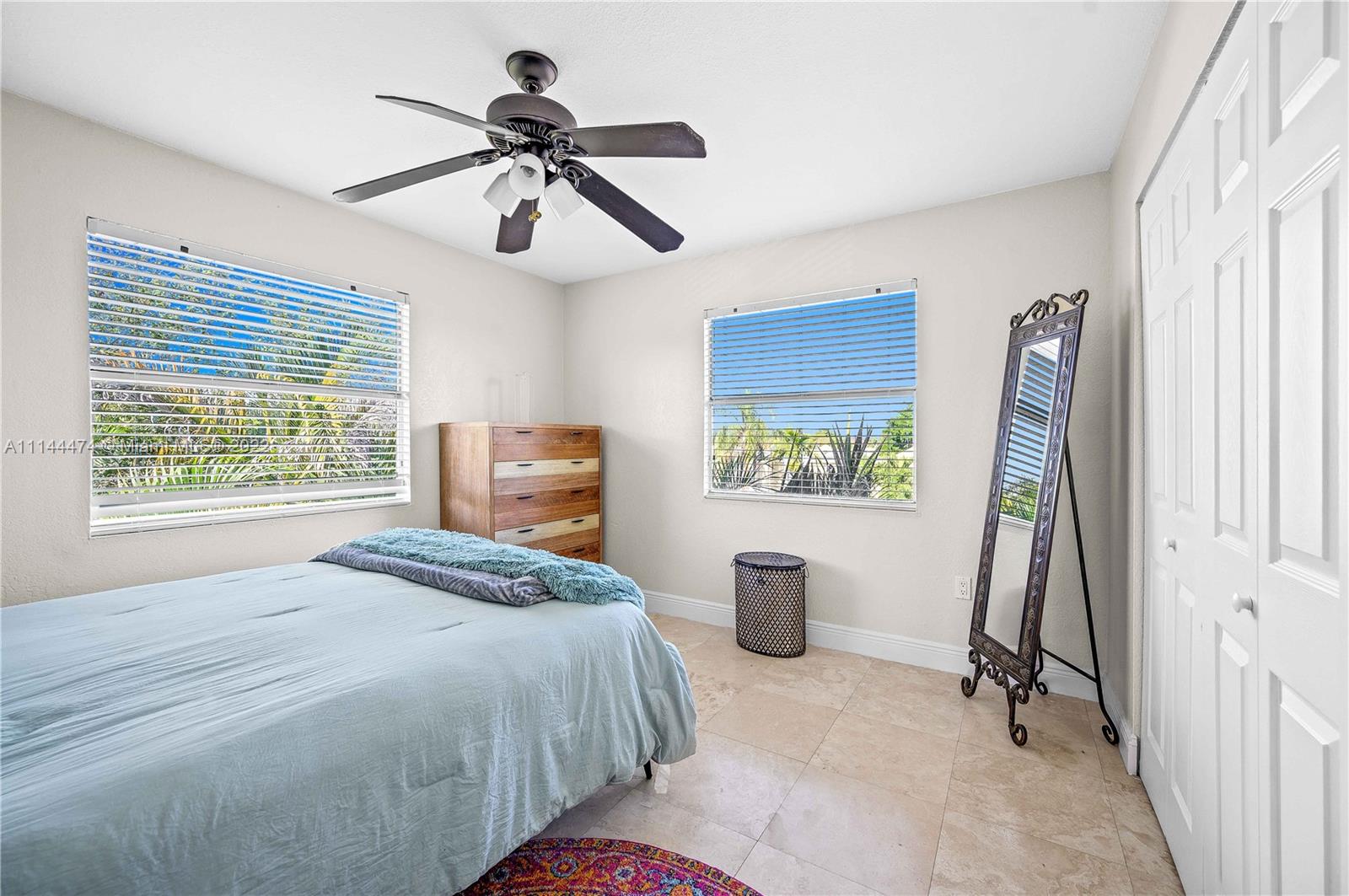 4600 Southwest 67th Avenue, Unit 240 Miami, FL 33155 - Photo 13 of 20 a bedroom with a bed and a window