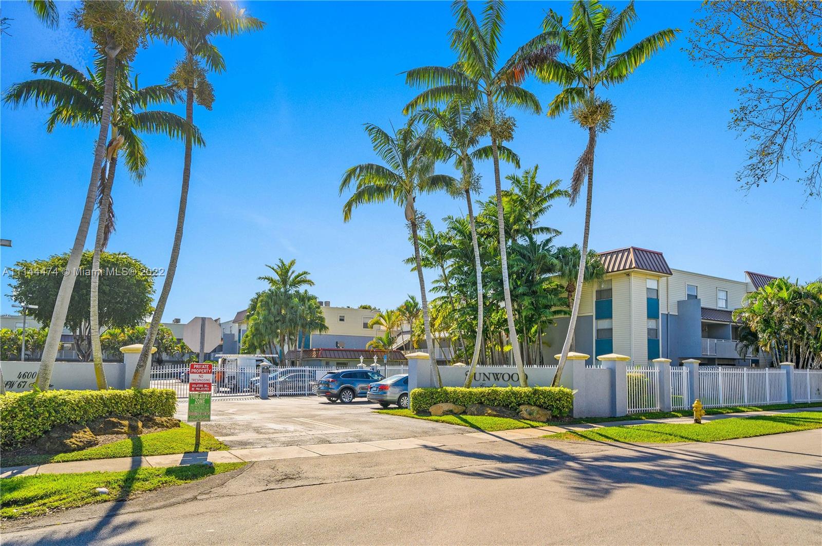 4600 Southwest 67th Avenue, Unit 240 Miami, FL 33155 - Photo 18 of 20 a view of a backyard with palm trees