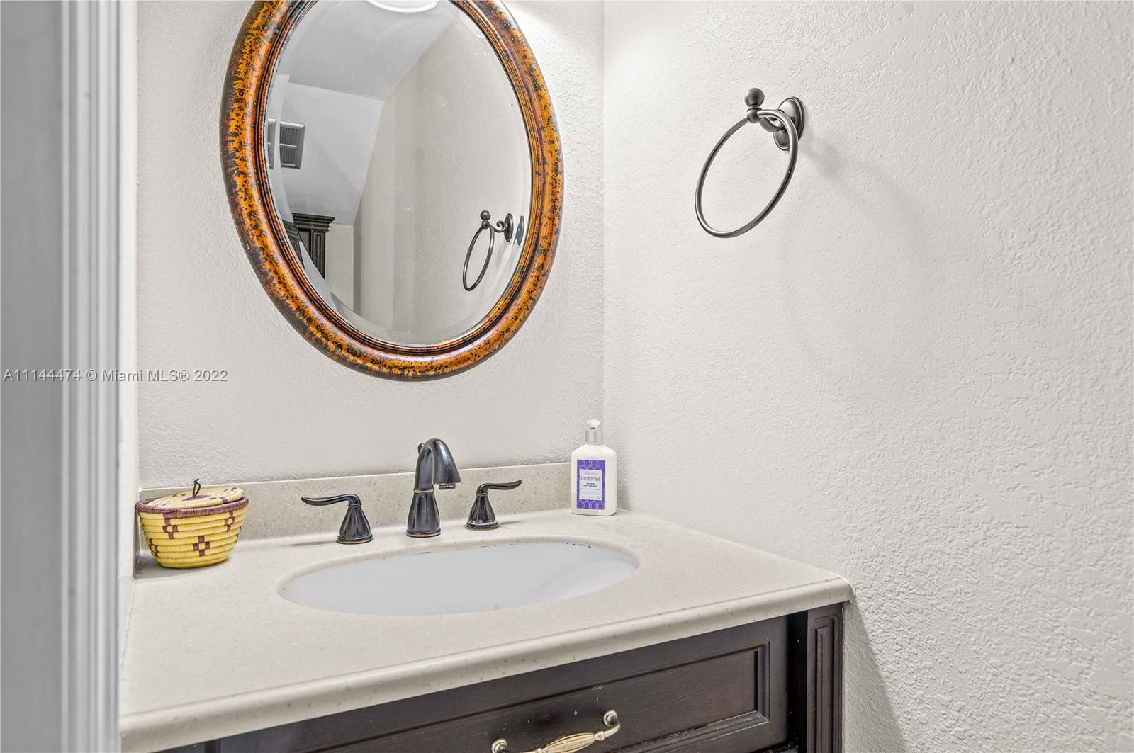4600 Southwest 67th Avenue, Unit 240 Miami, FL 33155 - Photo 9 of 20 a bathroom with a sink and a mirror