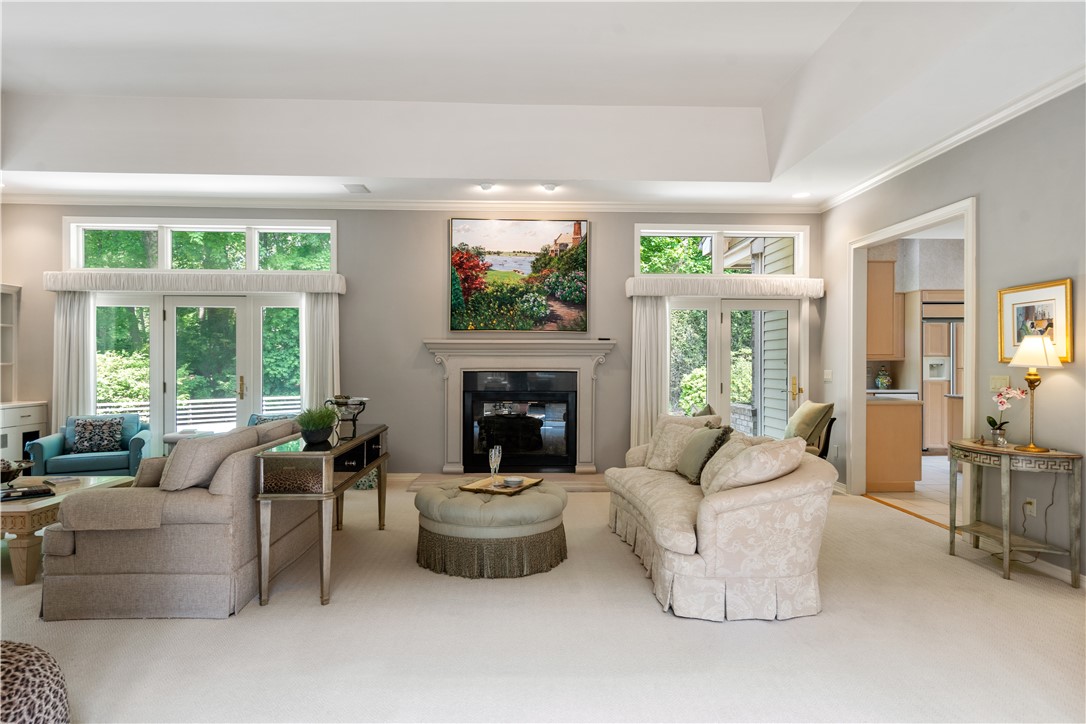 7 Oak Tree Lane Cranston, RI 02920 - Photo 5 of 32 Dramatic Tray Ceiling design, custom Built-ins 2 sets of French Doors Gas Fireplace and custom Built-ins