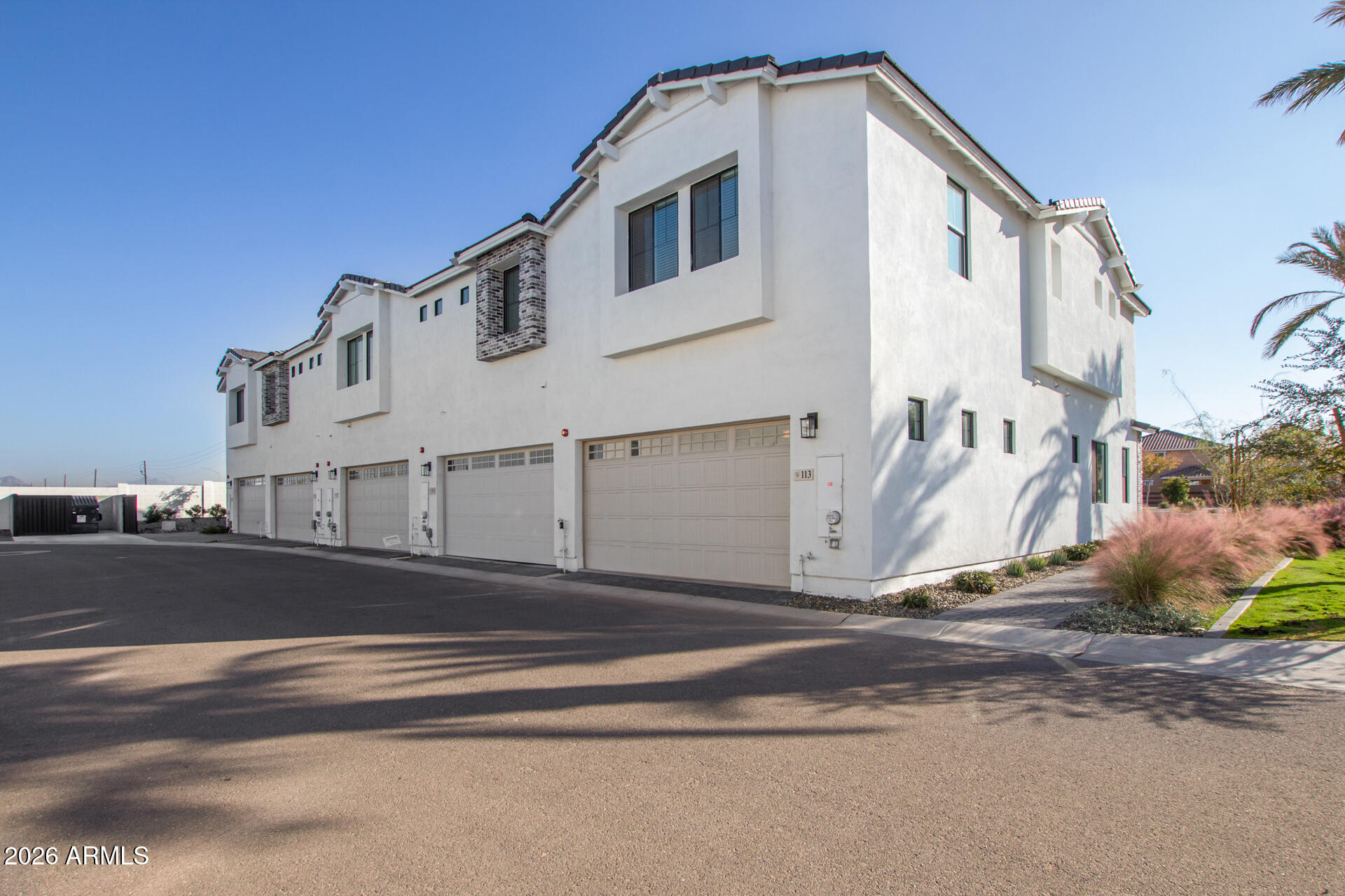 3230 East Thomas Road, Unit 114 Mesa, AZ 85213 - Photo 26 of 27 a view of a house with a street